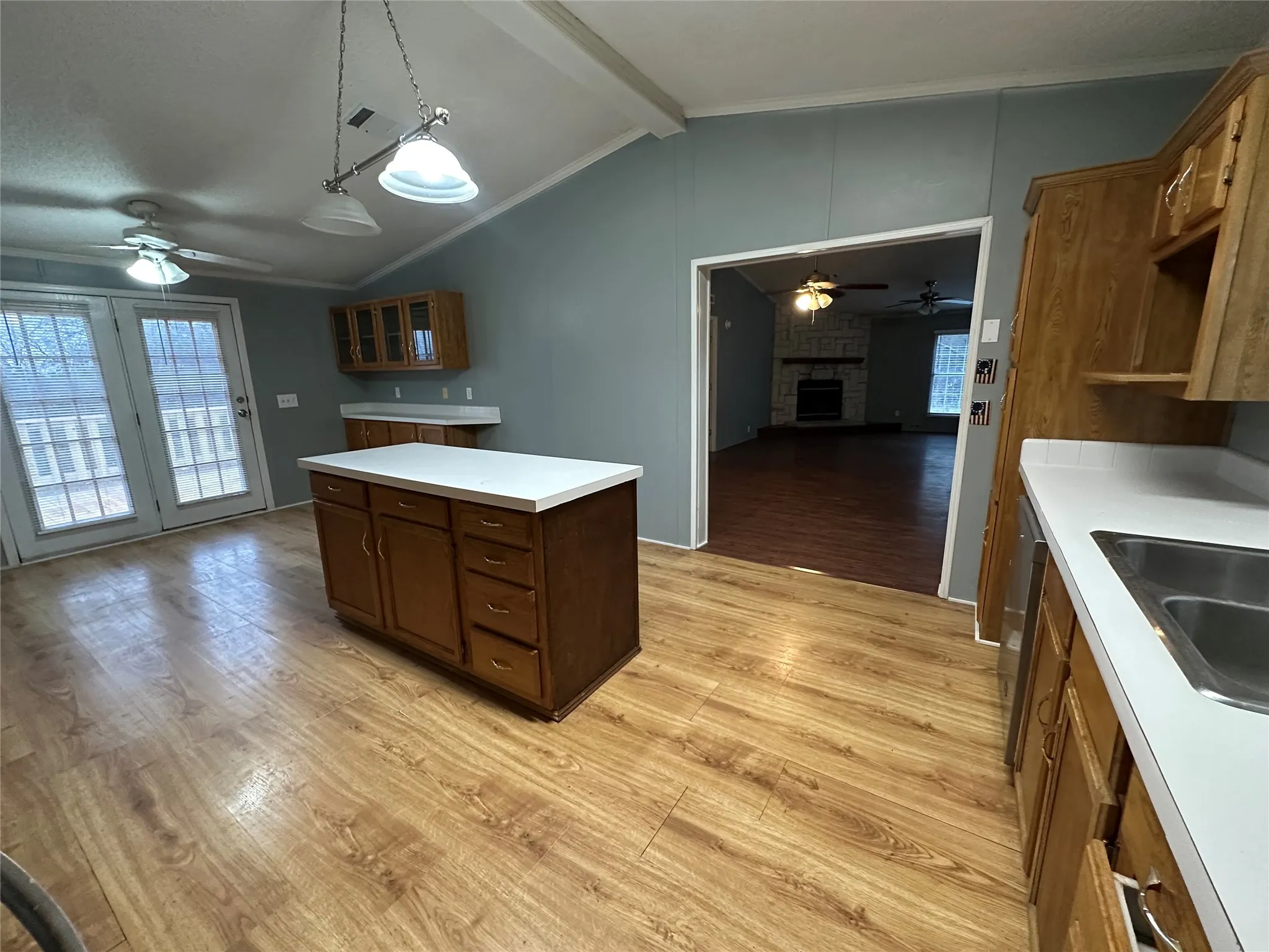 Featuring island with built-in cabinets for extra storage!