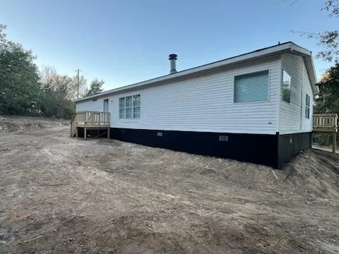A stretch of space across the back/side of home.