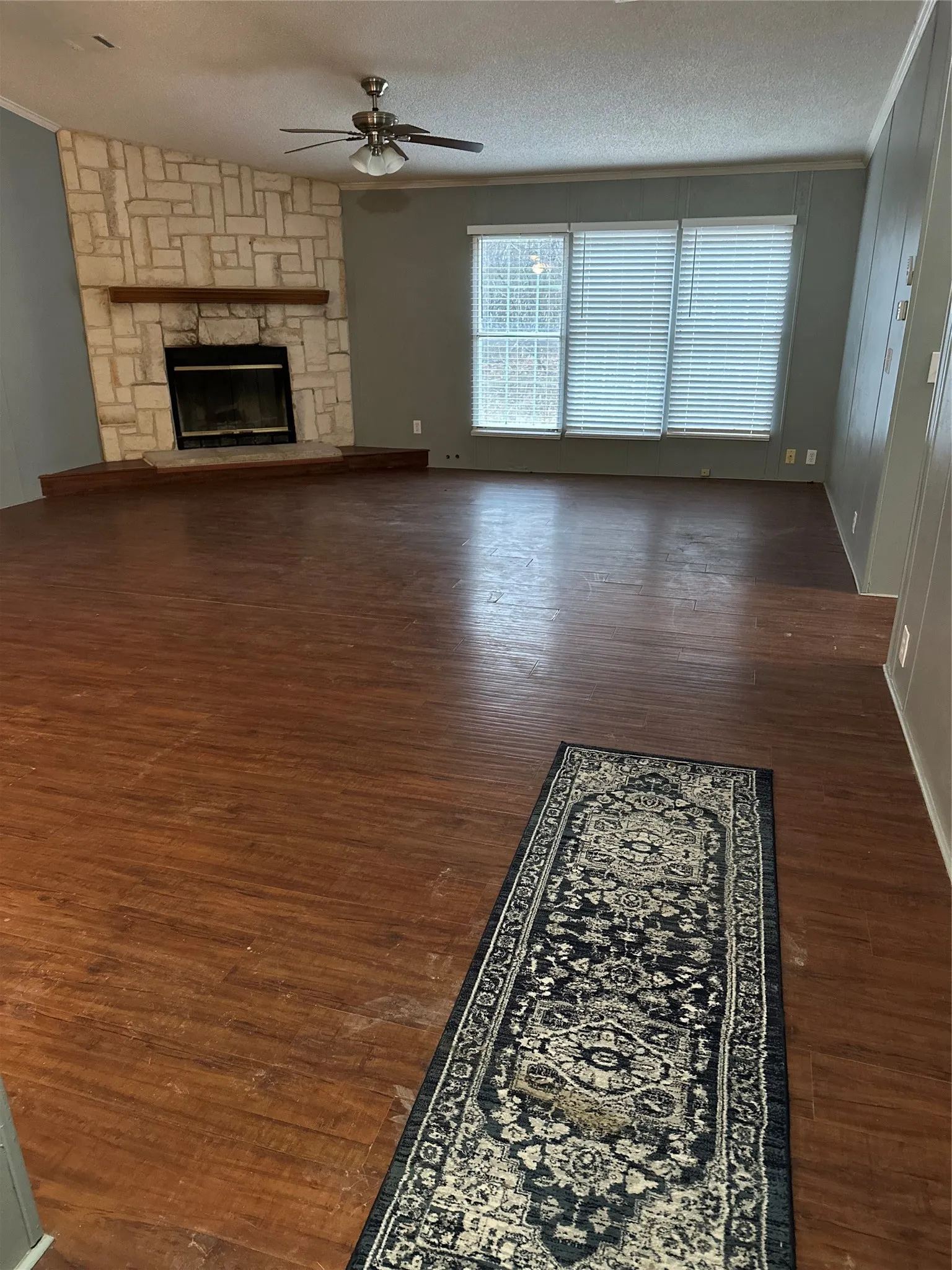 Features Stone woodburning fireplace.