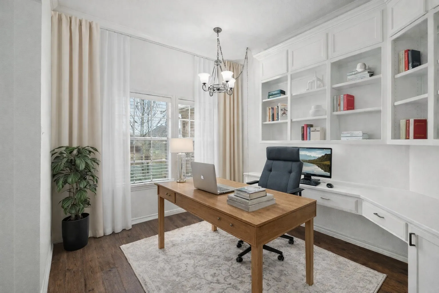 Office area with a chandelier, built in features, and dark wood-type flooring