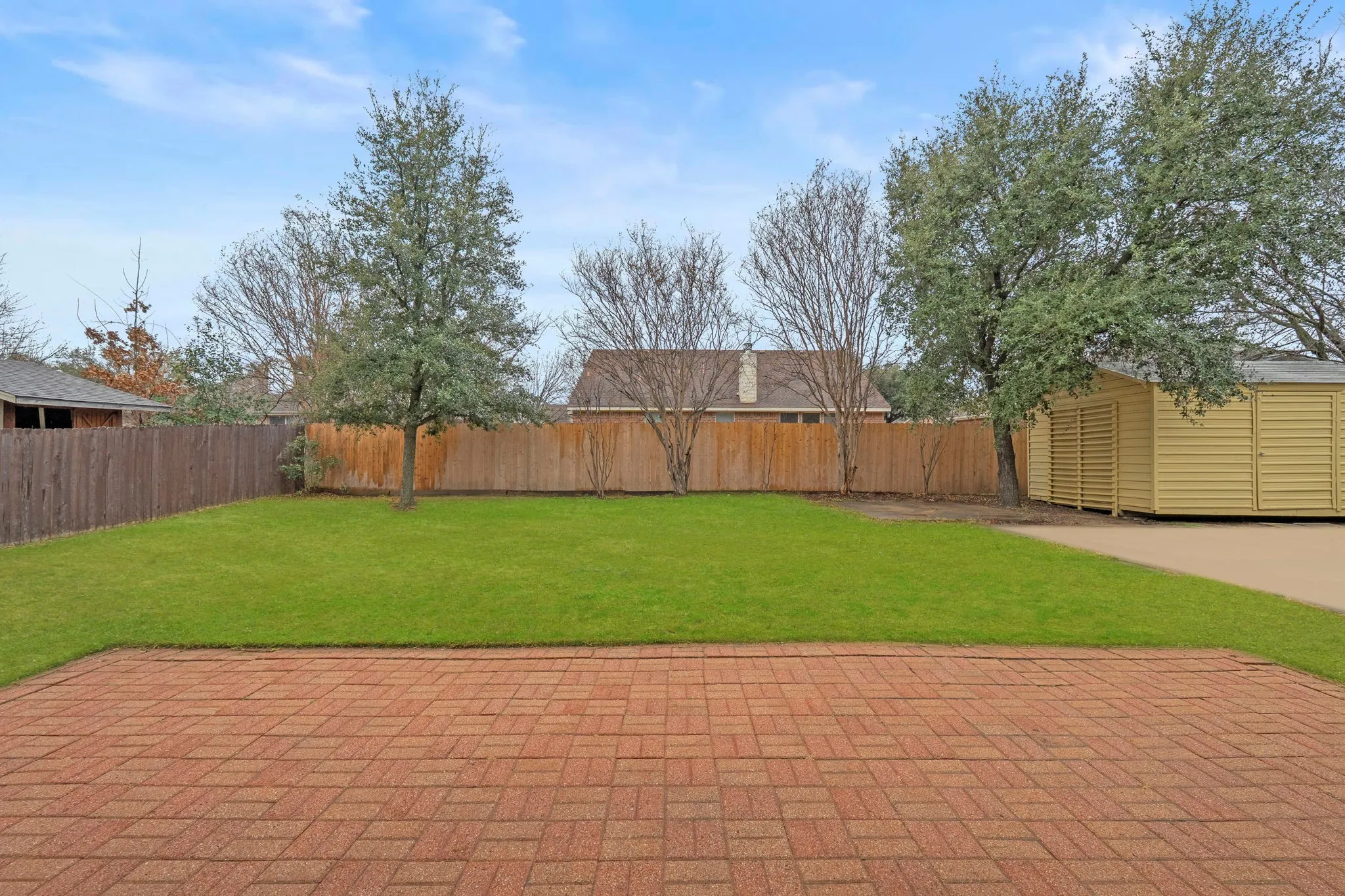 View of fenced backyard