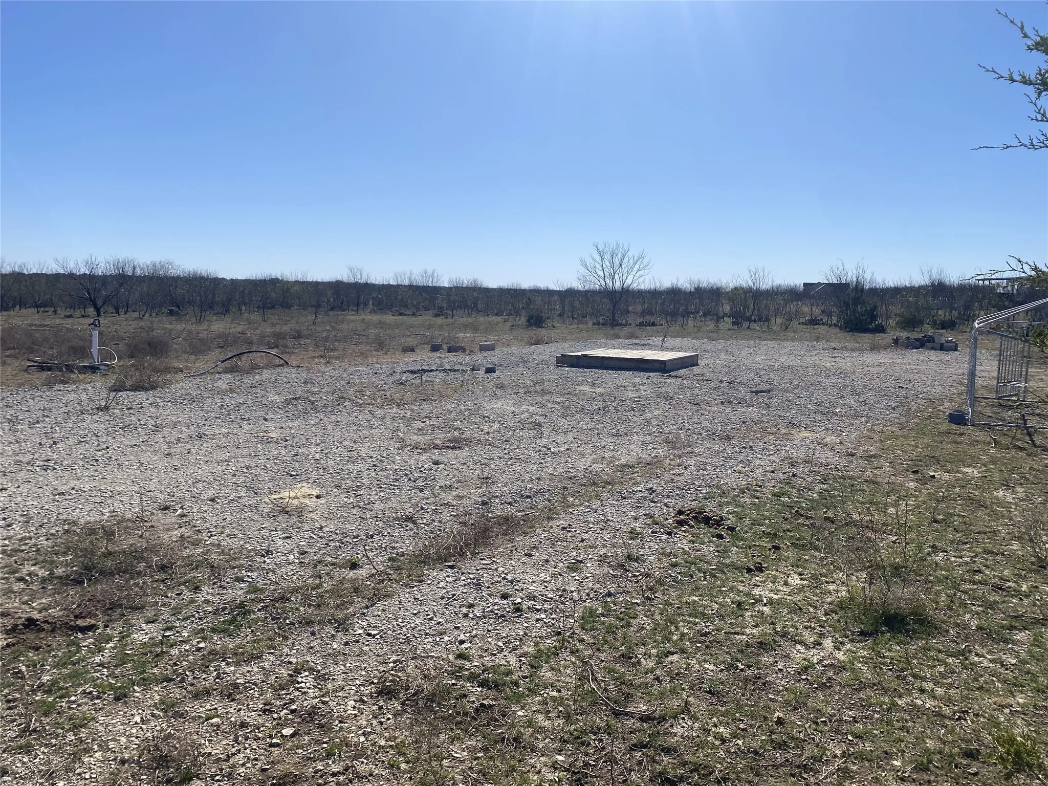 Construction dirt home pad large enough and long enough for double-wide mobile home, already in place