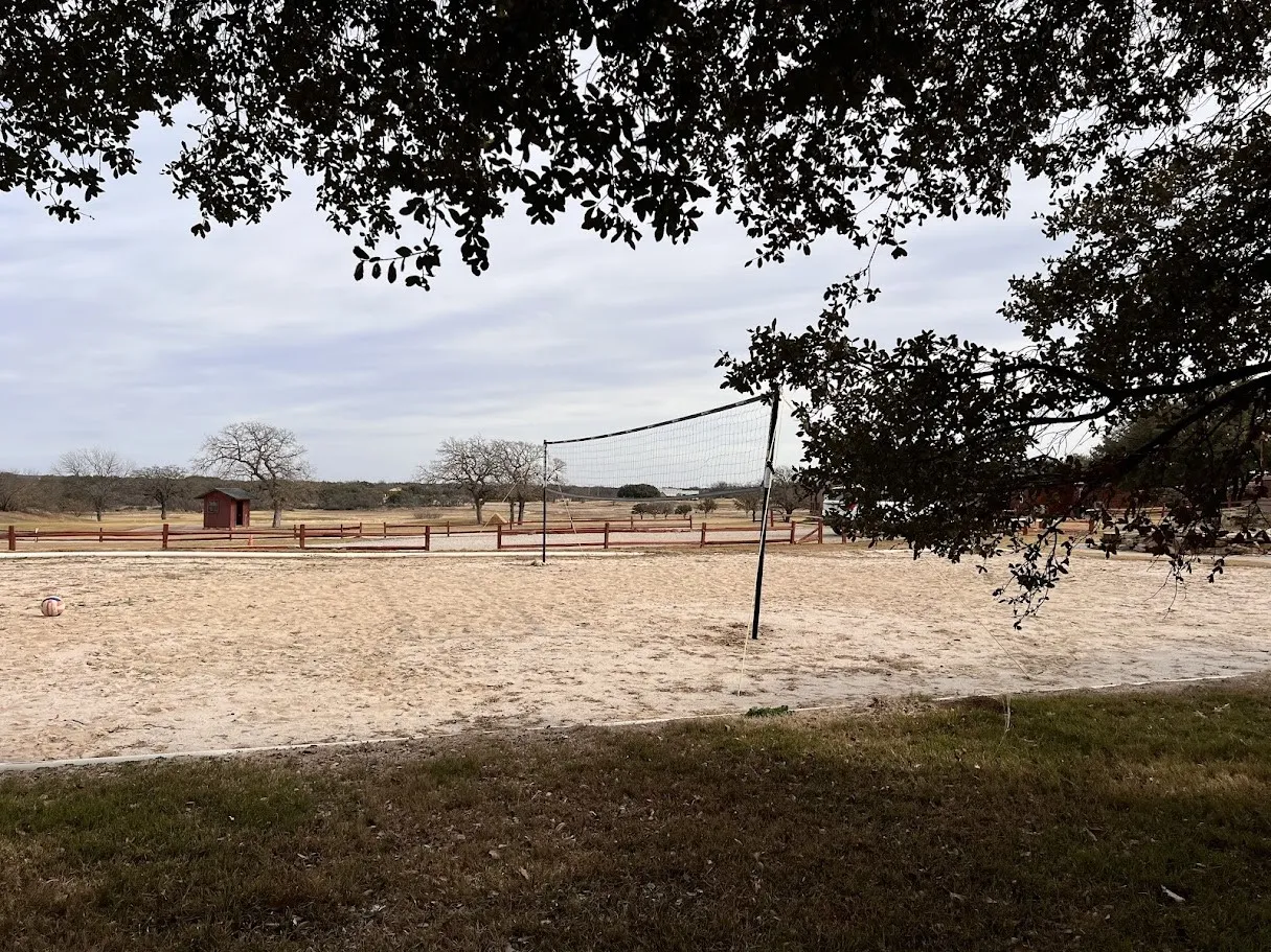 Surrounding community with volleyball court- The Hideout