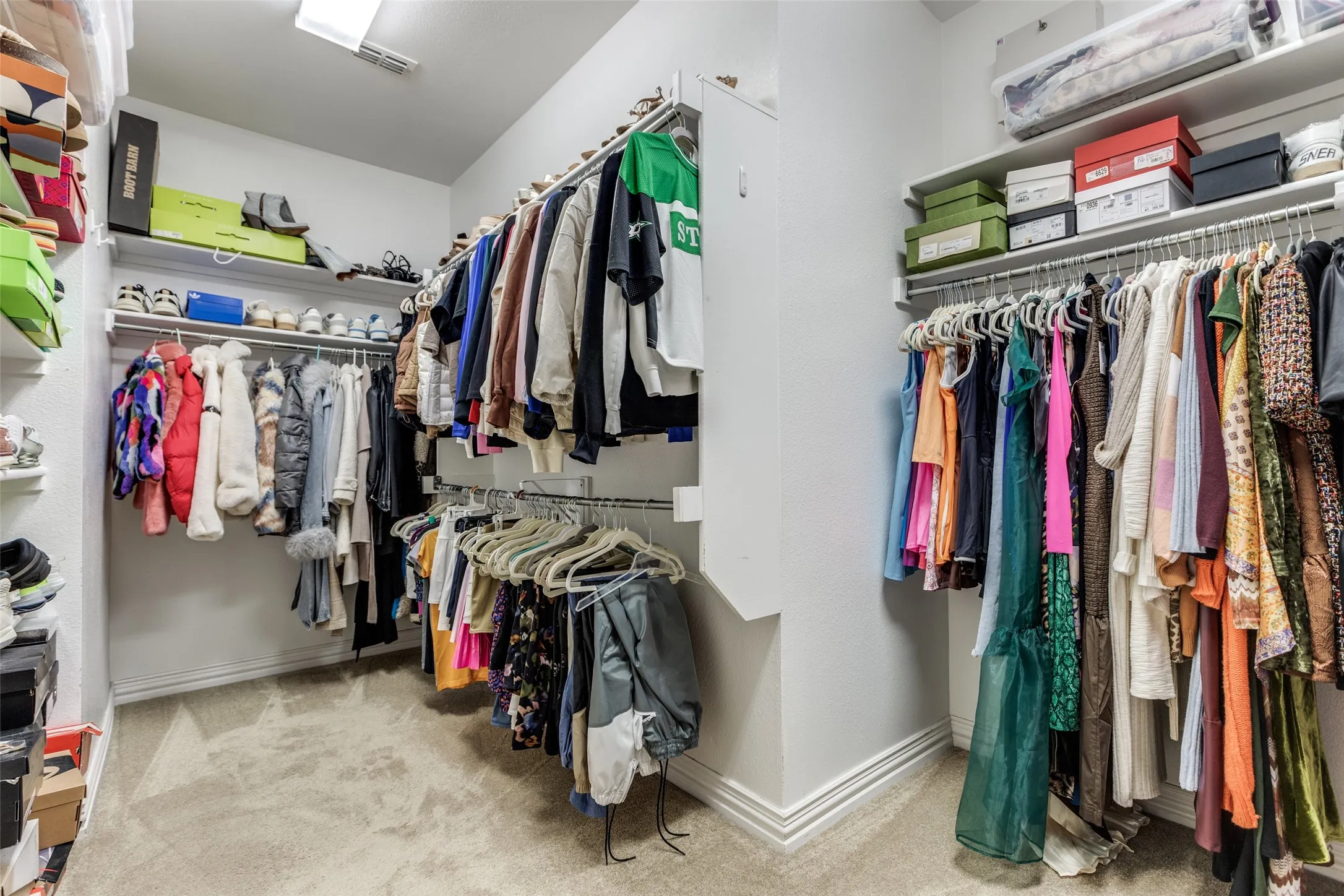 Primary walk-in closet partial view