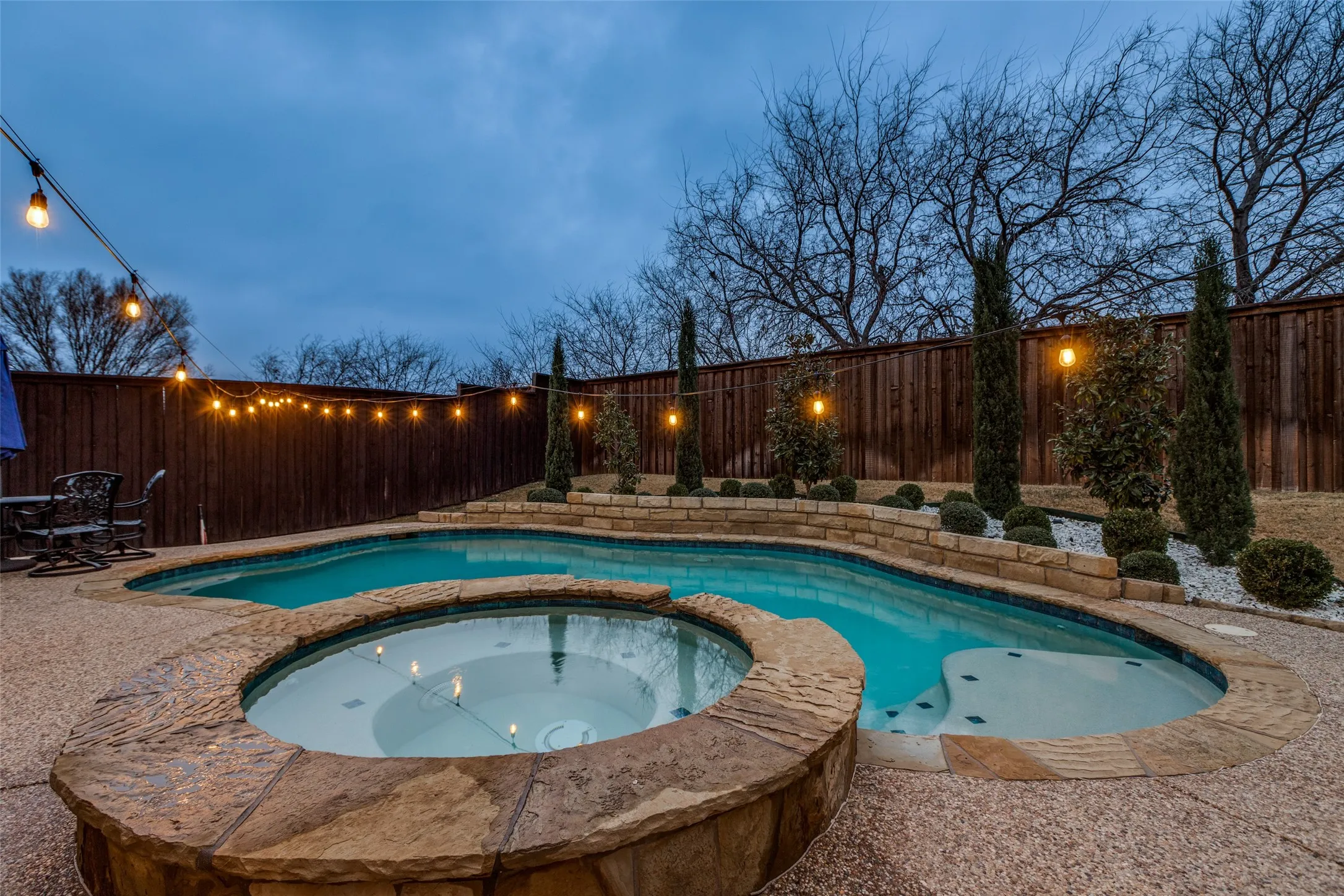 Spa with waterfall into pool