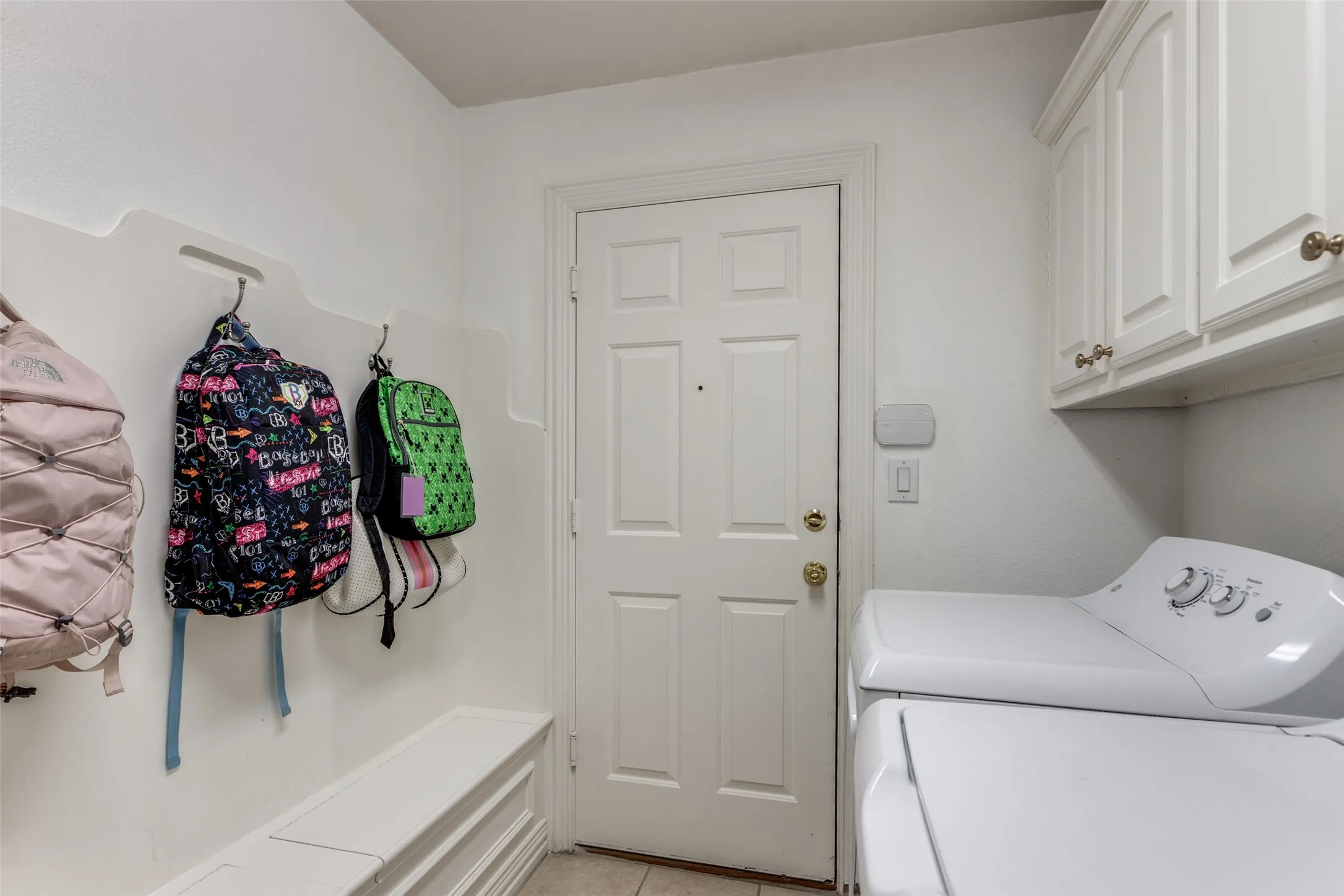 Laundry mudroom with area for second refrigerator