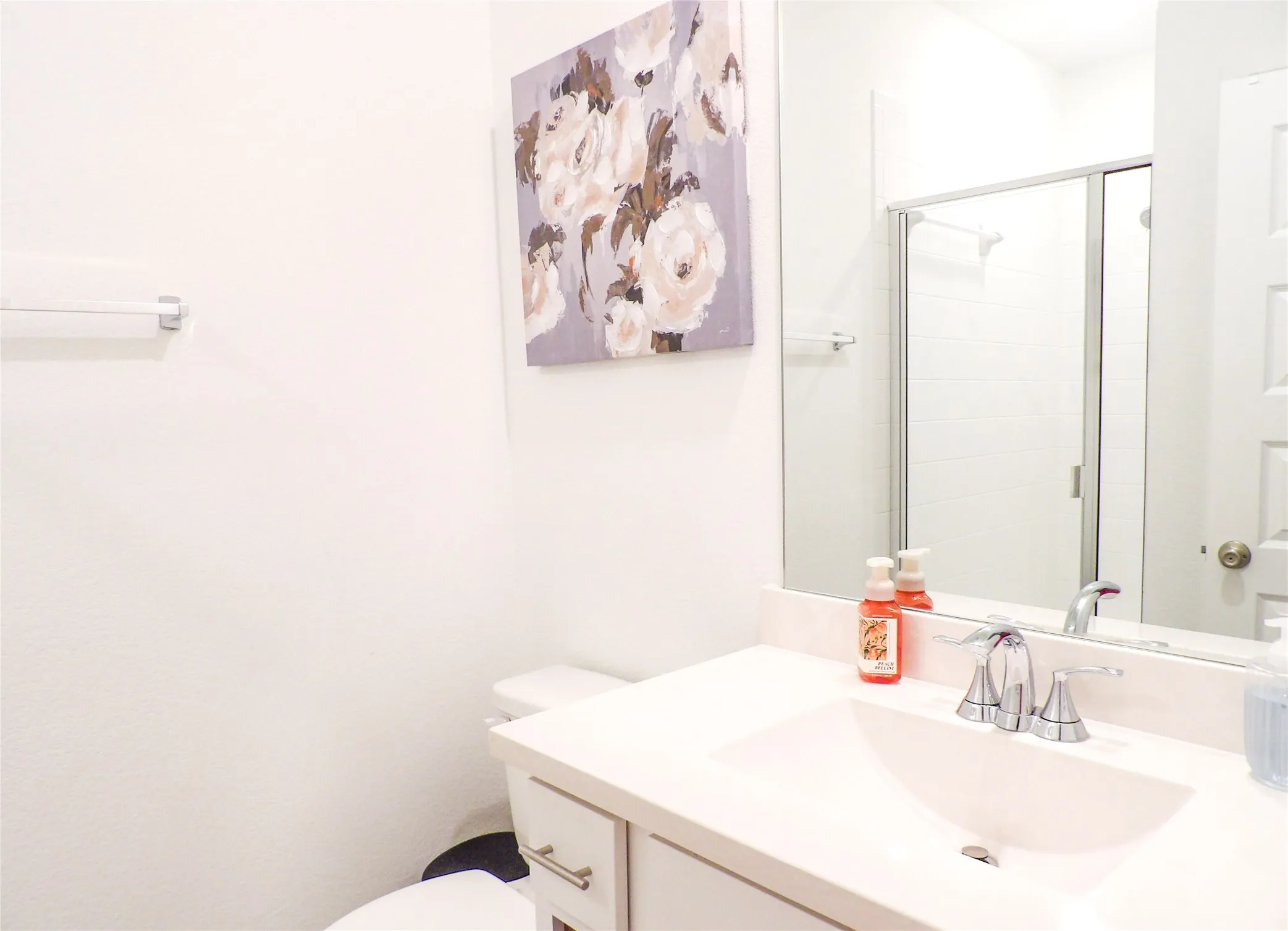 Full Guest bath featuring a stall shower and vanity
