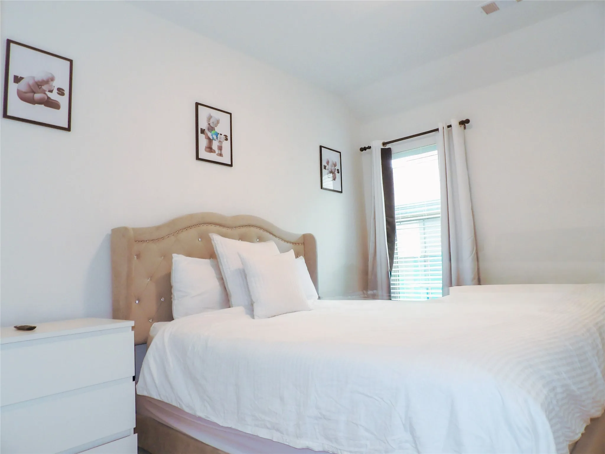 Bedroom with lofted ceiling