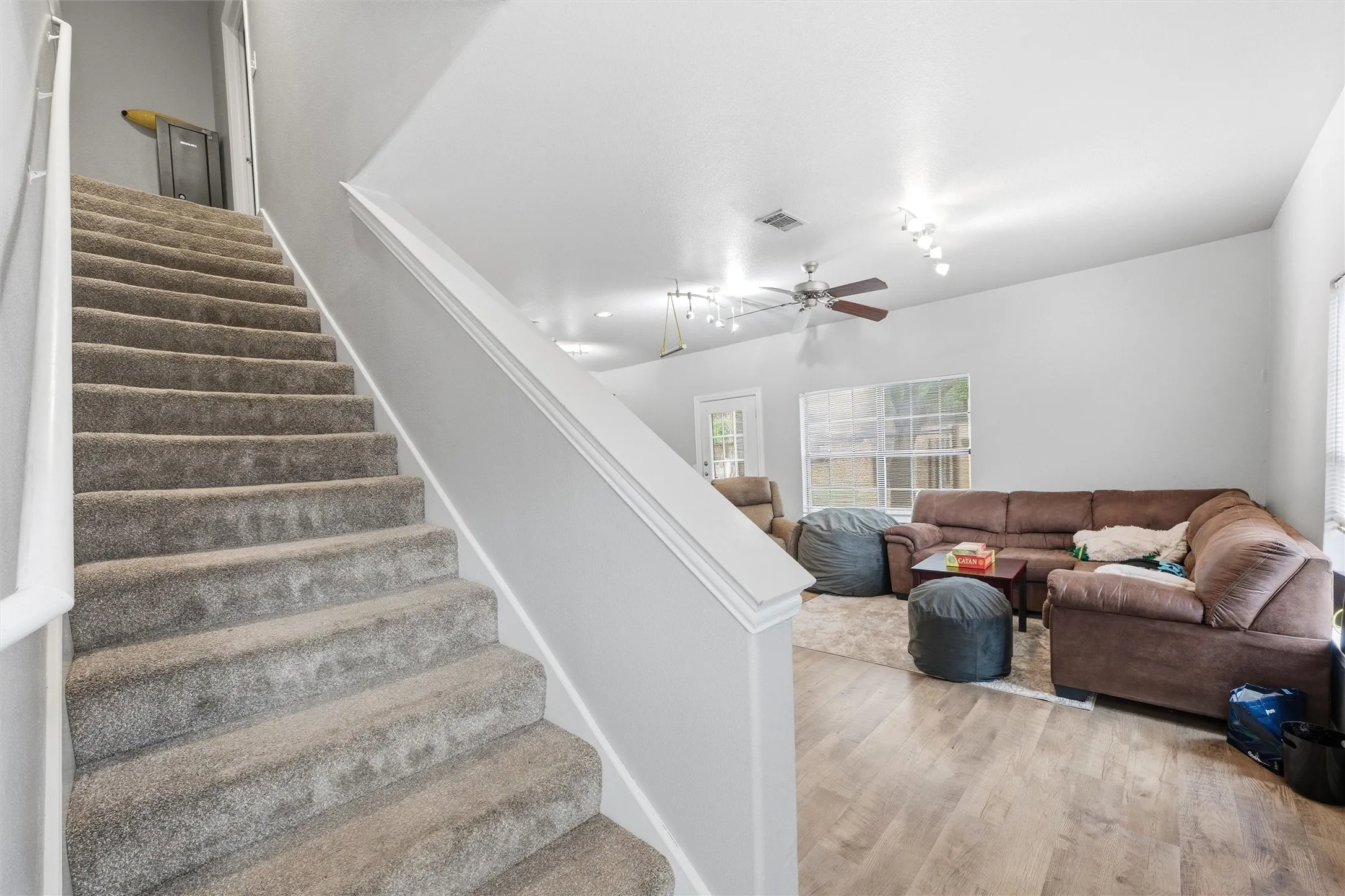 stairway off living room and near garage entry door