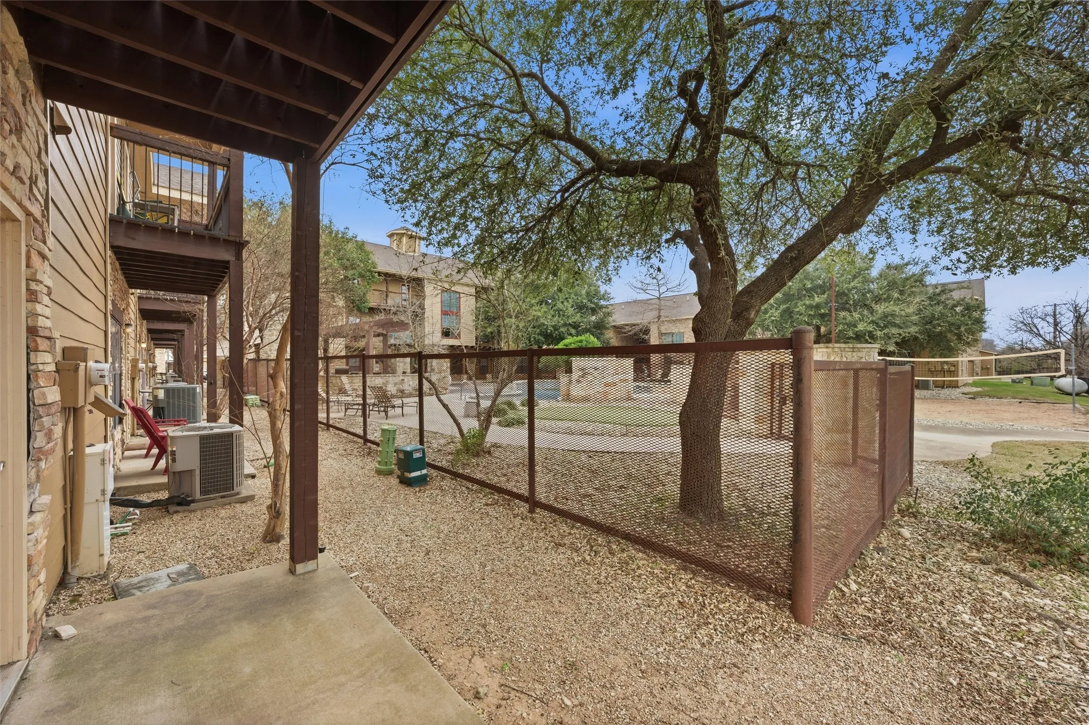 covered back porch and view of the community pool
