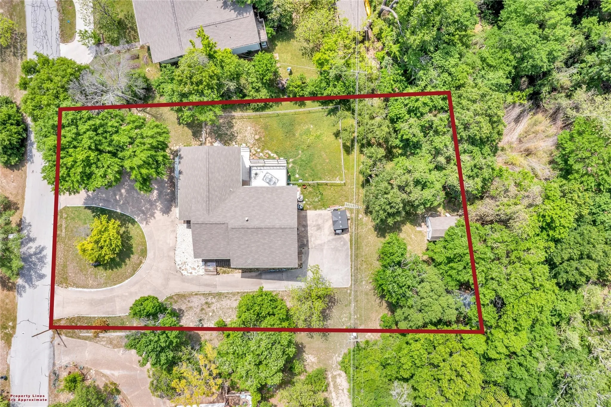 Heavily treed, serene, private!  Extra storage sheds and tons of parking!