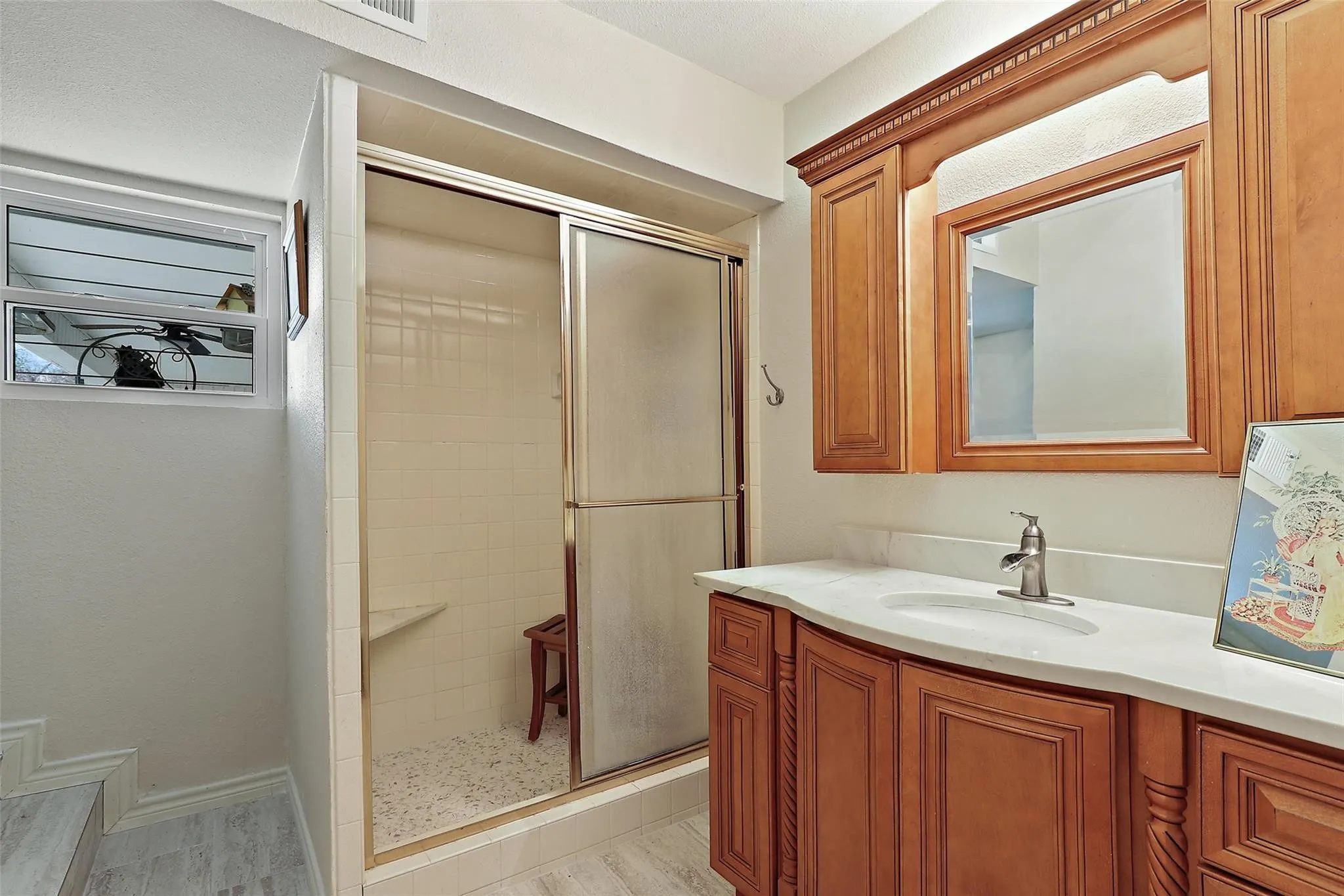 Secondary bathroom with new cabinets and flooring!