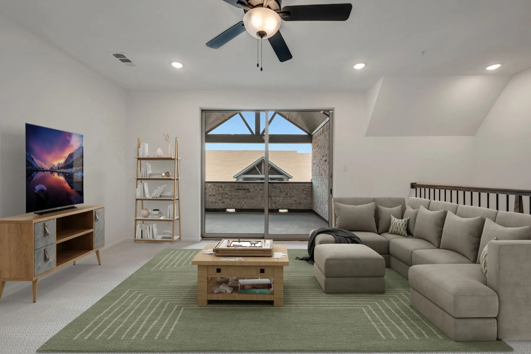 Living area featuring recessed lighting, a ceiling fan, and access to an outdoor balcony through a glass sliding door