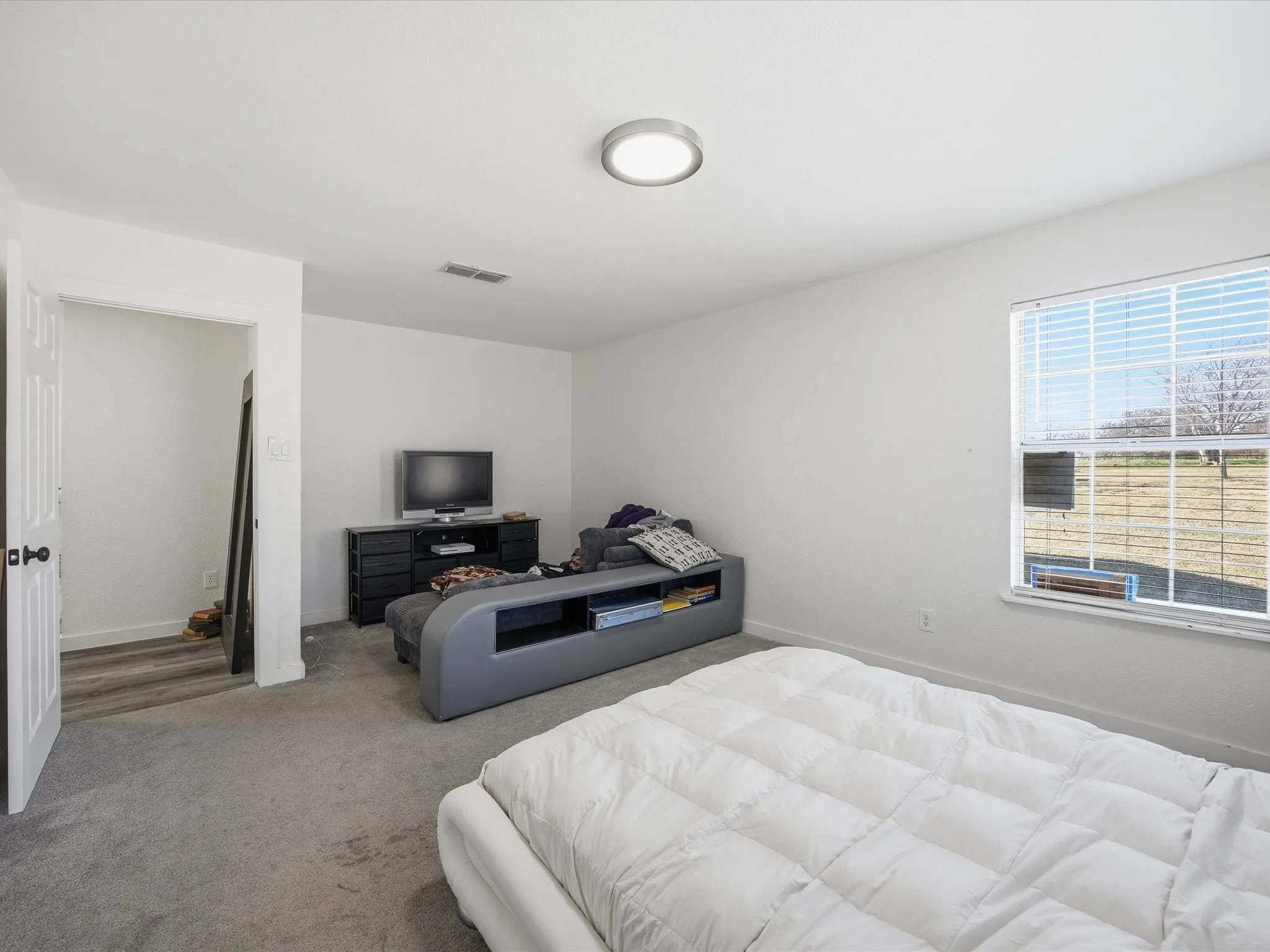 Bedroom with carpet and baseboards