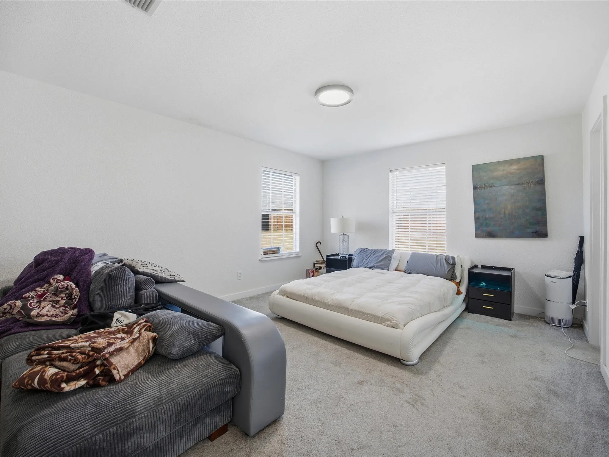 Bedroom featuring carpet flooring and baseboards