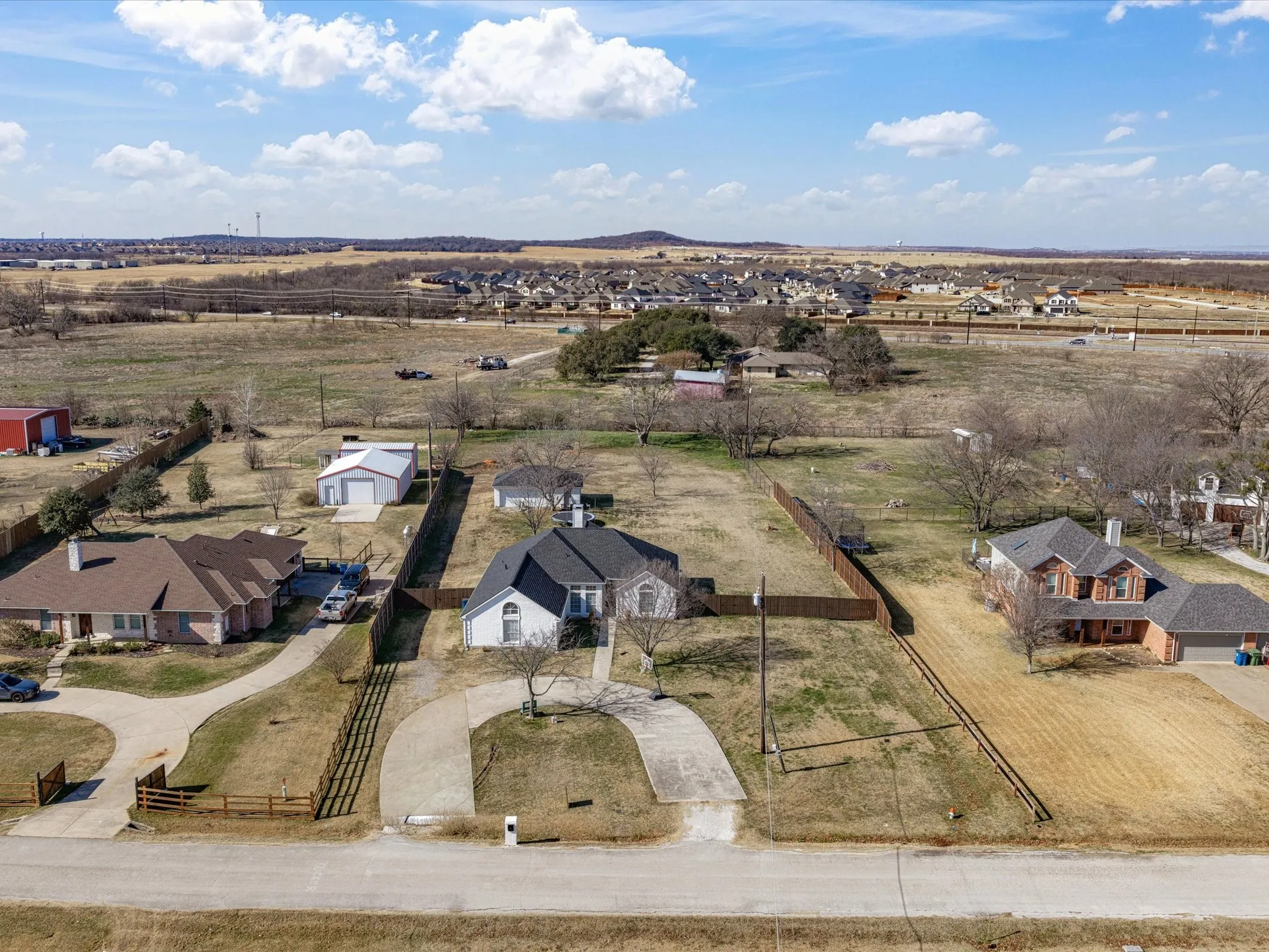 Overview of rural landscape featuring nearby suburban area