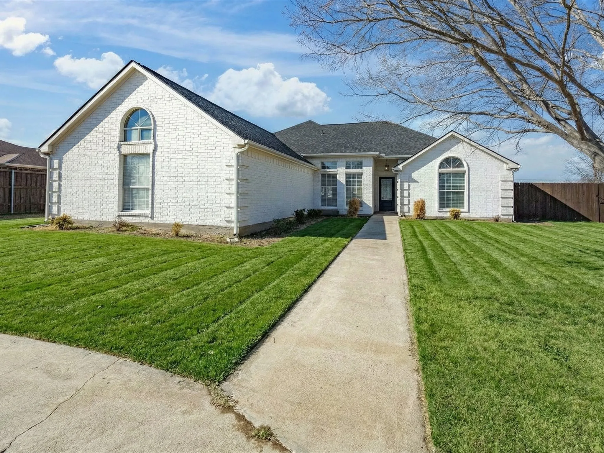 Ranch-style home with brick siding