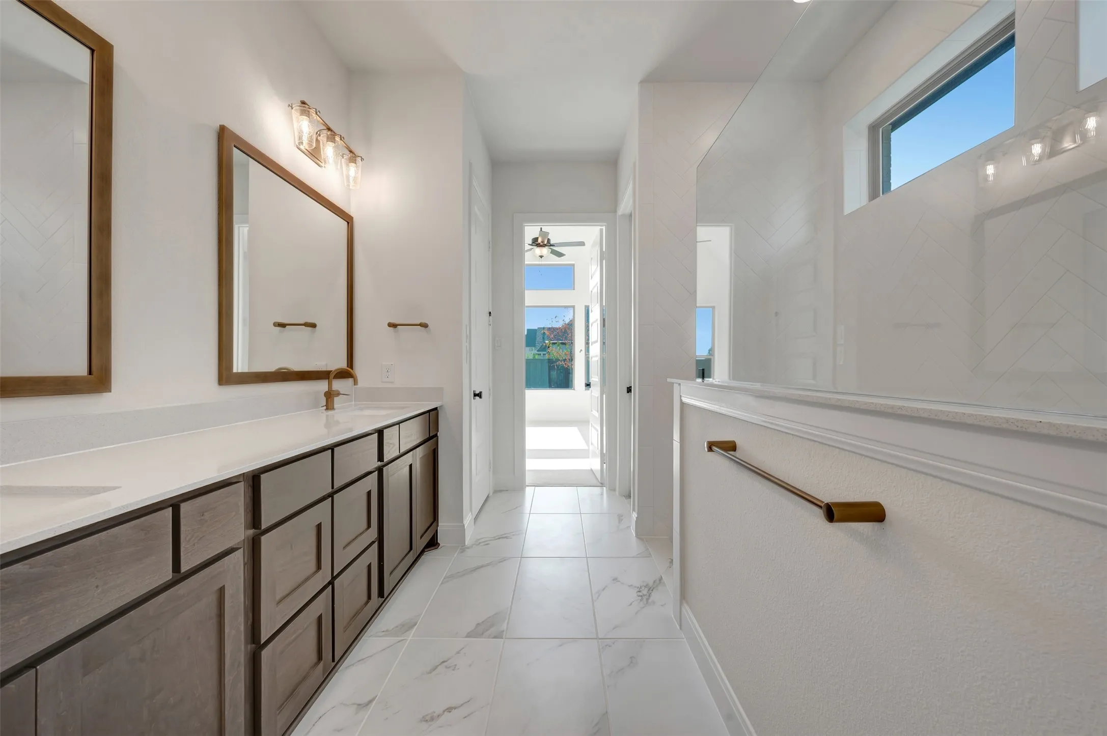 Dual vanity with wood-finish cabinetry and light countertops