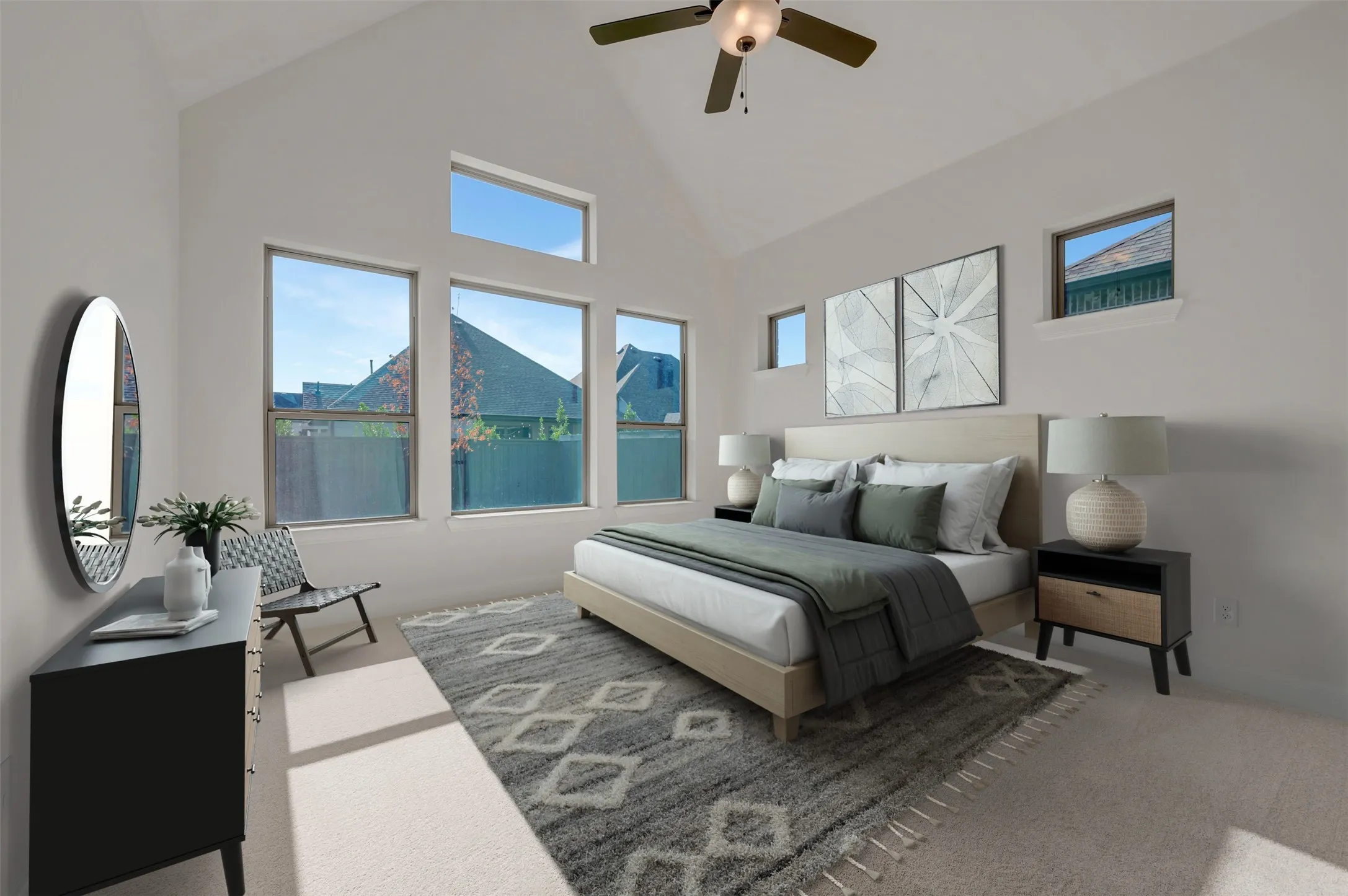 Vaulted ceiling room featuring multiple windows, a ceiling fan with integrated lighting, and neutral wall tones
