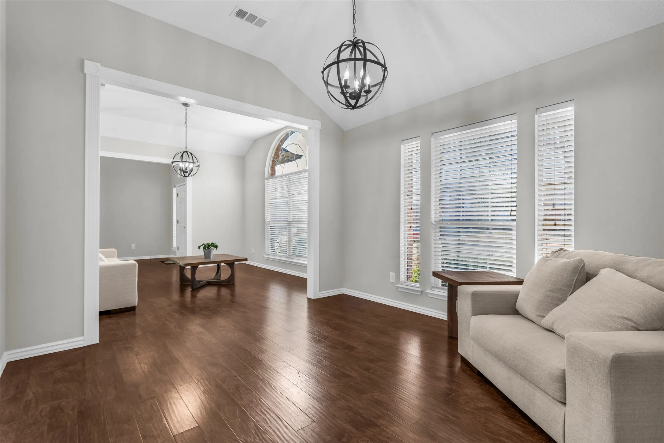 Sun-drenched flex space off the main living area, perfect for reading, relaxing, or a plant sanctuary.