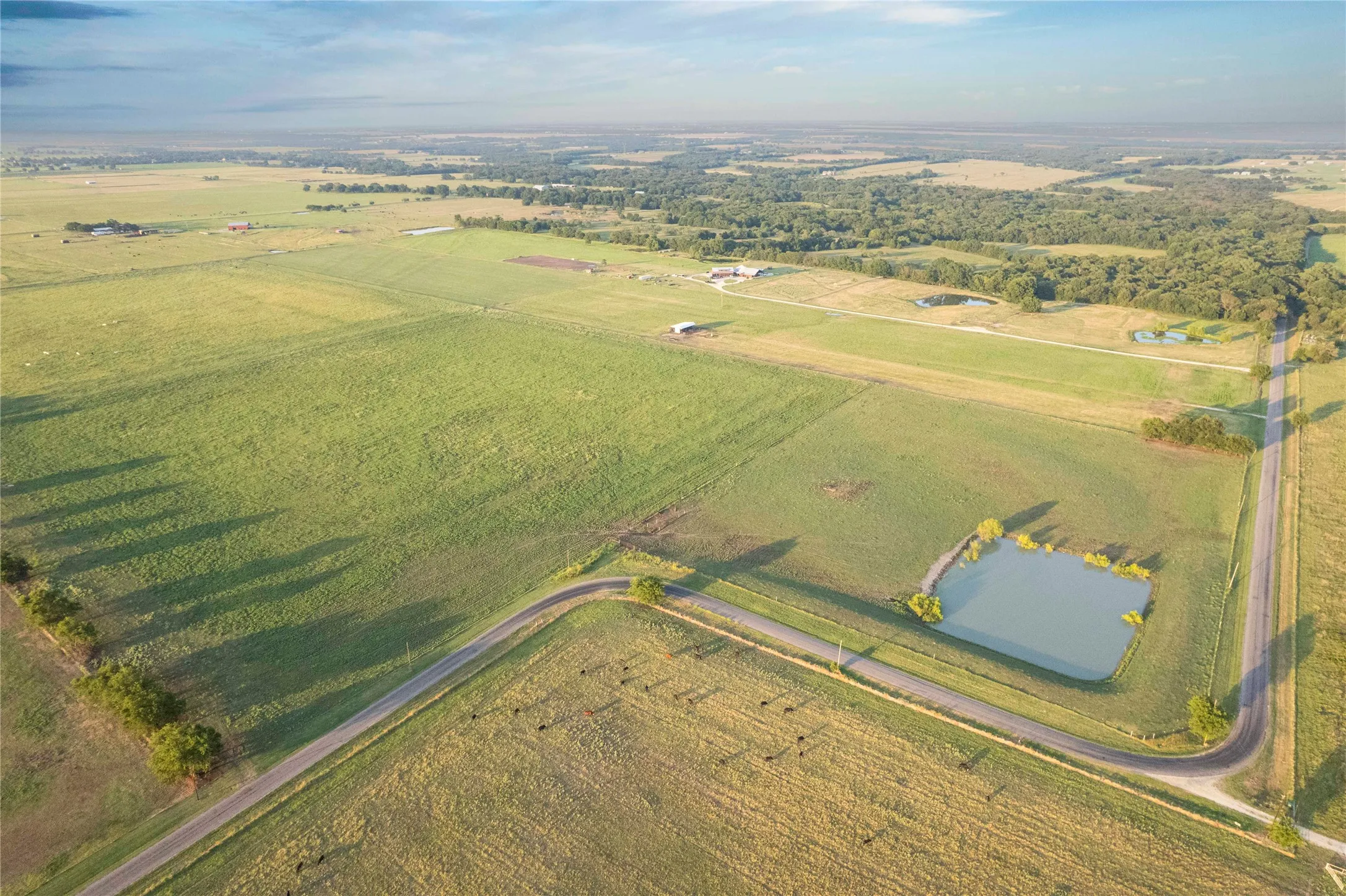 View of rural area with abundant farmland and a nearby body of water