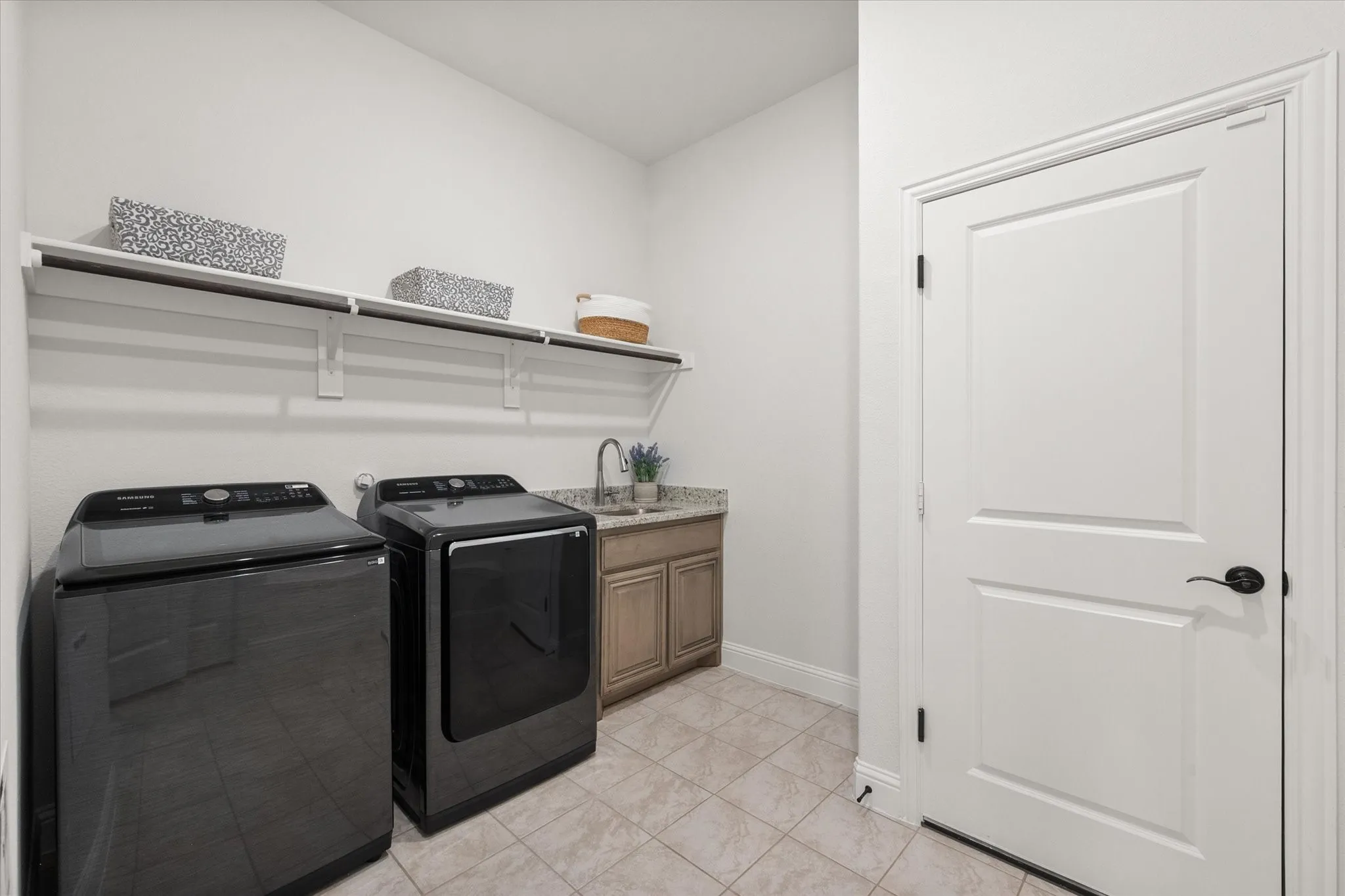 Spacious laundry room with built ins