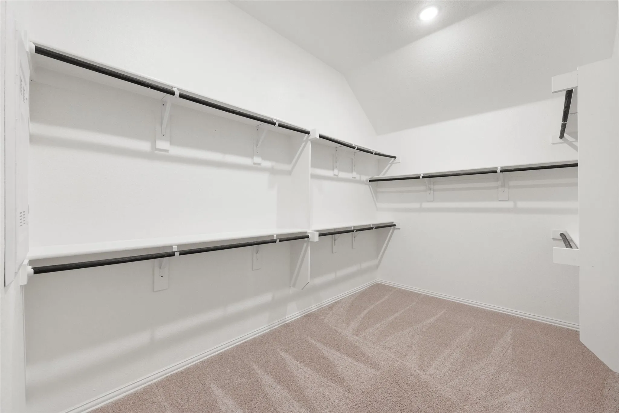 Primary closet with walk through to laundry room