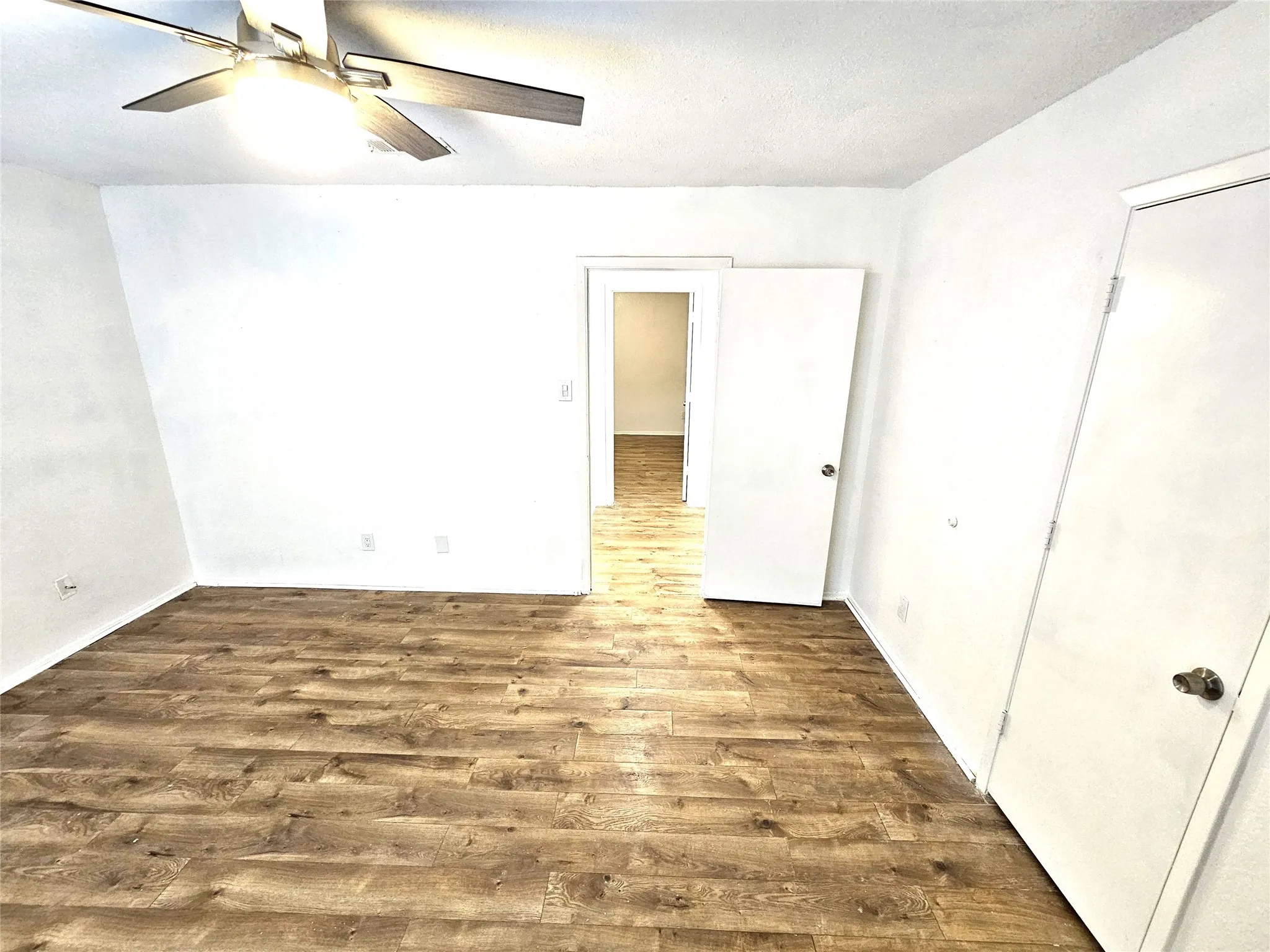 Bedroom #1-spacious bedroom (13x13) with new modern ceiling fan & wood laminate flooring - no carpet in this townhome. Stairs is wood laminate as well.