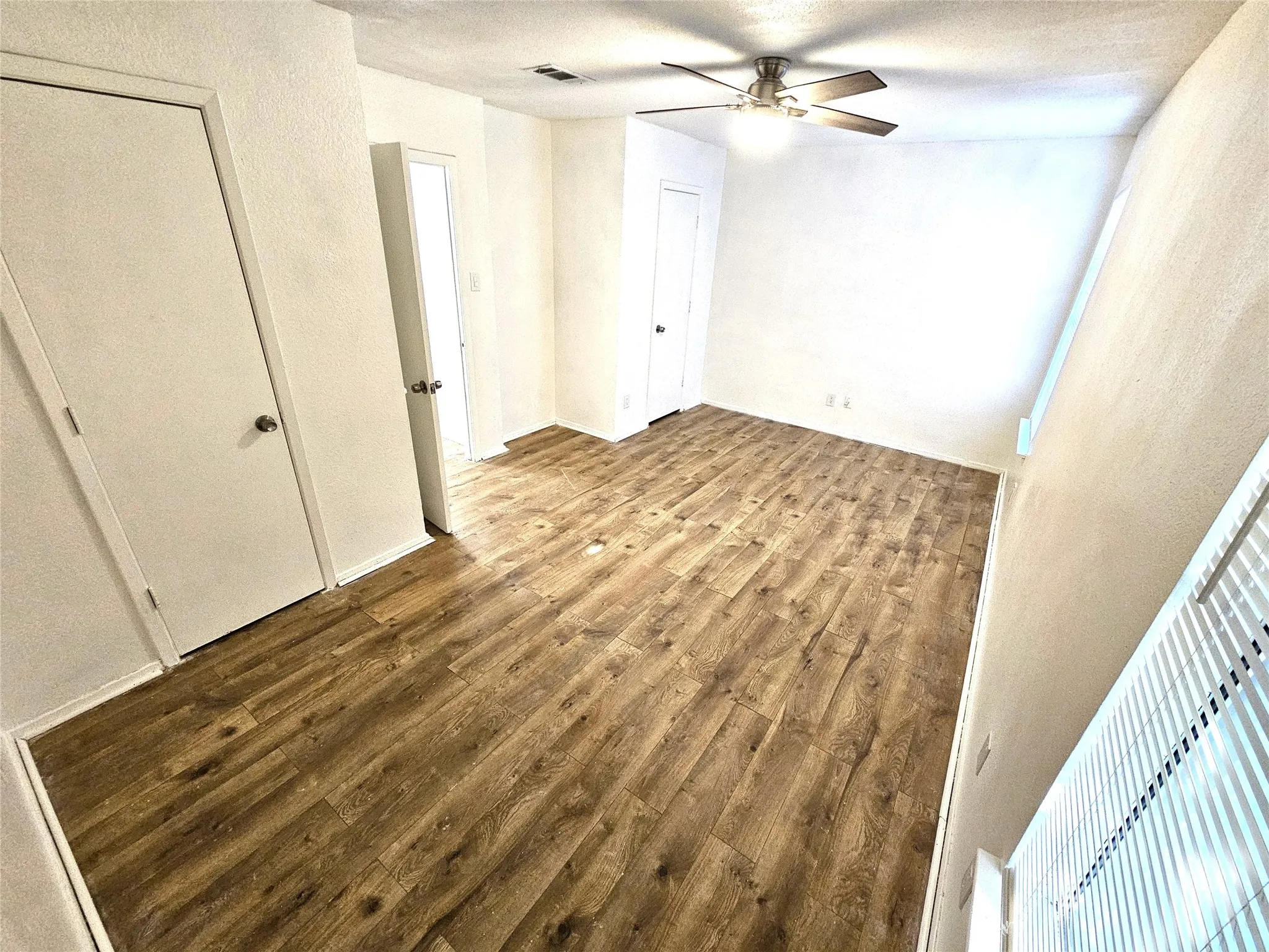 Bedroom#2-Another good size bedroom (13x13) with new ceiling fan & new wood laminate floor. And with double closets as well.