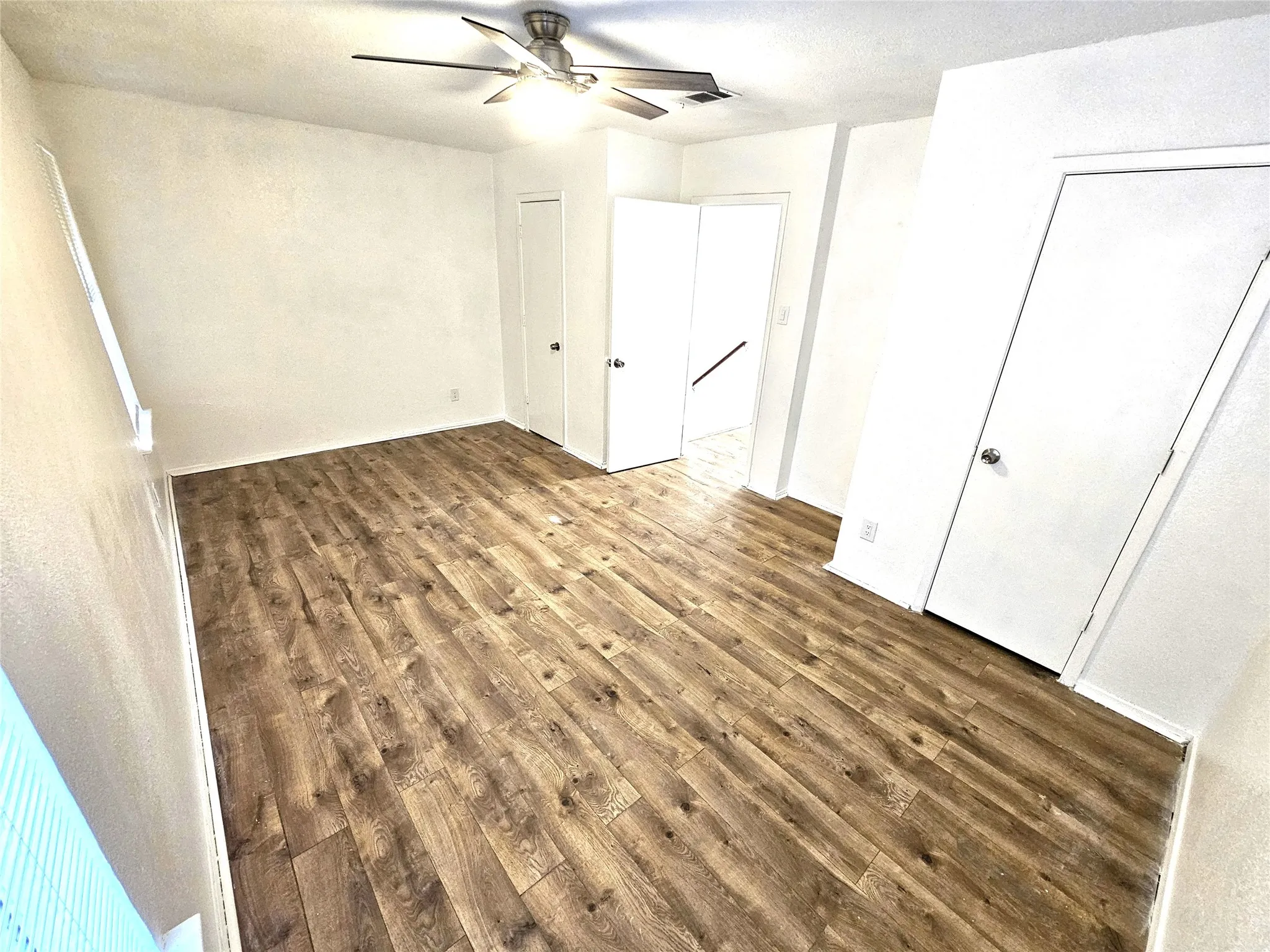 Bedroom#2-Another good size bedroom (13x13) with new ceiling fan & new wood laminate floor. And with double closets as well.