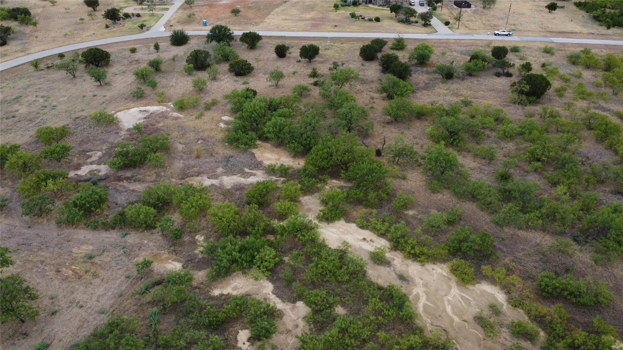 Birds eye view of property with a rural view