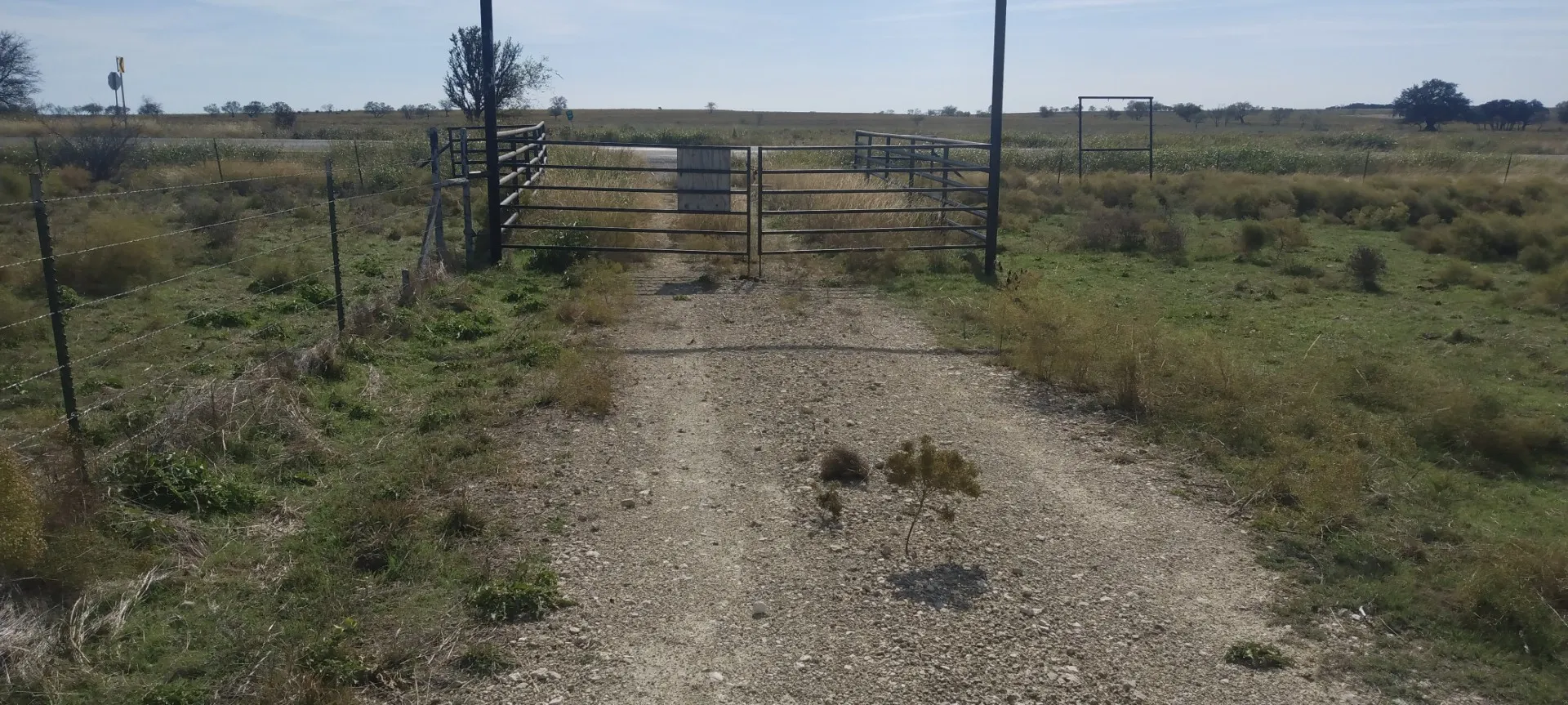 View of gate with a rural view