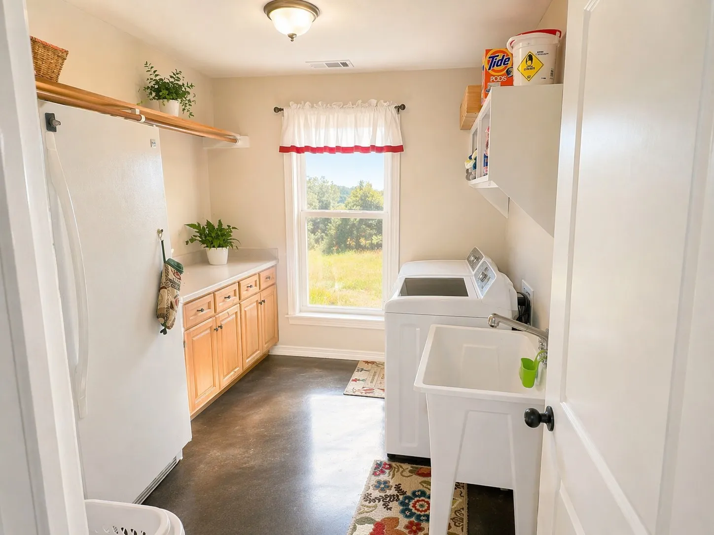 spacious laundry room with utility sink