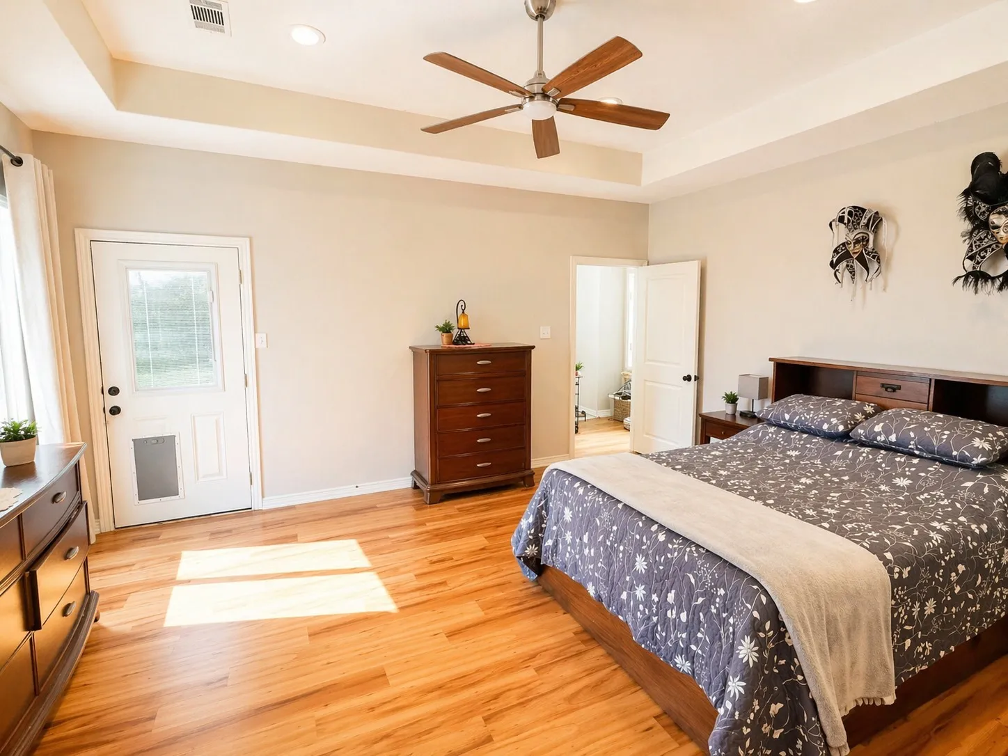 Primary Bedroom with private access to patio and doggy door