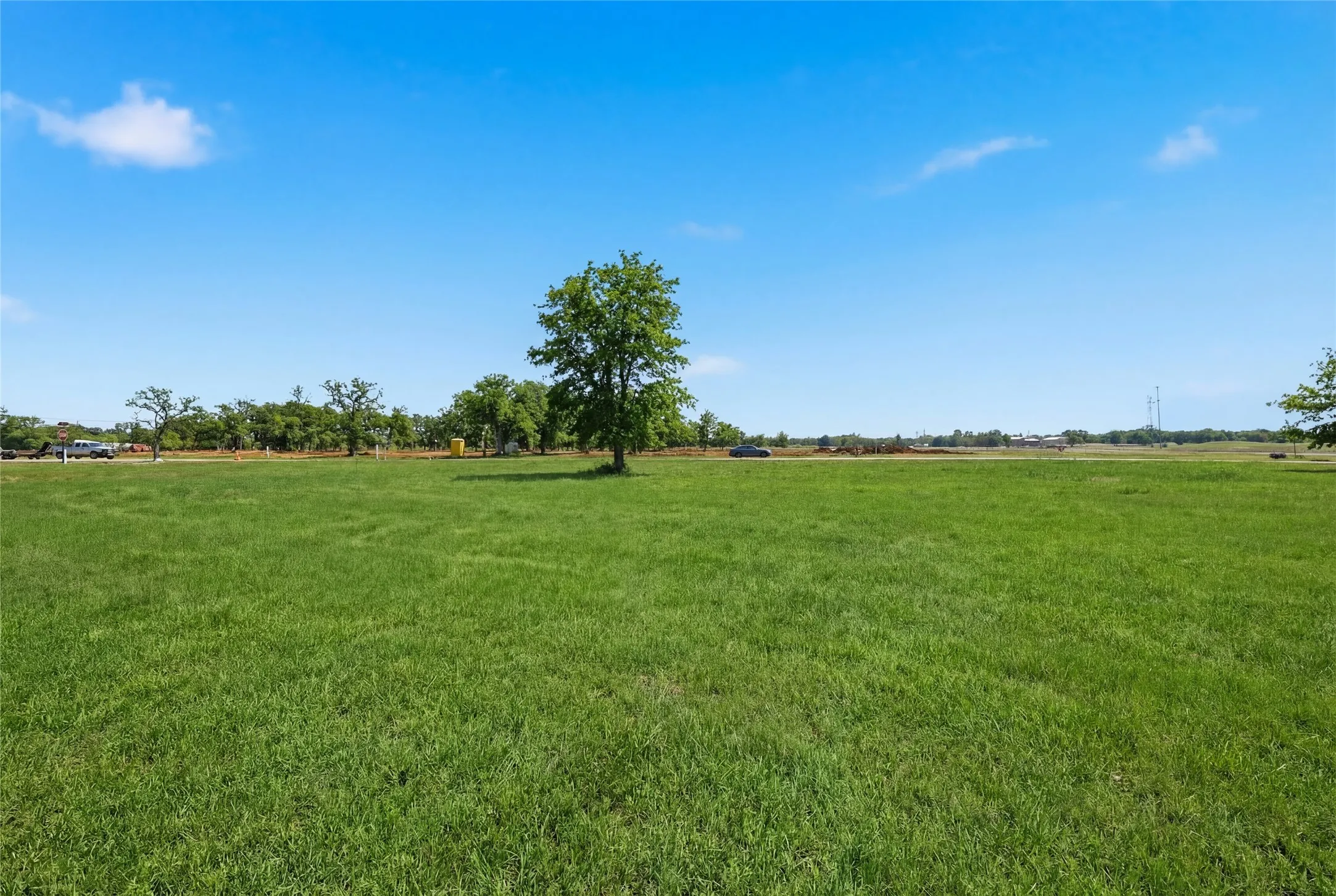 This is a photograph of Lot 13 Block H and was captured in February. It has been digitally enhanced to emphasize the presence of leaves and grass.
