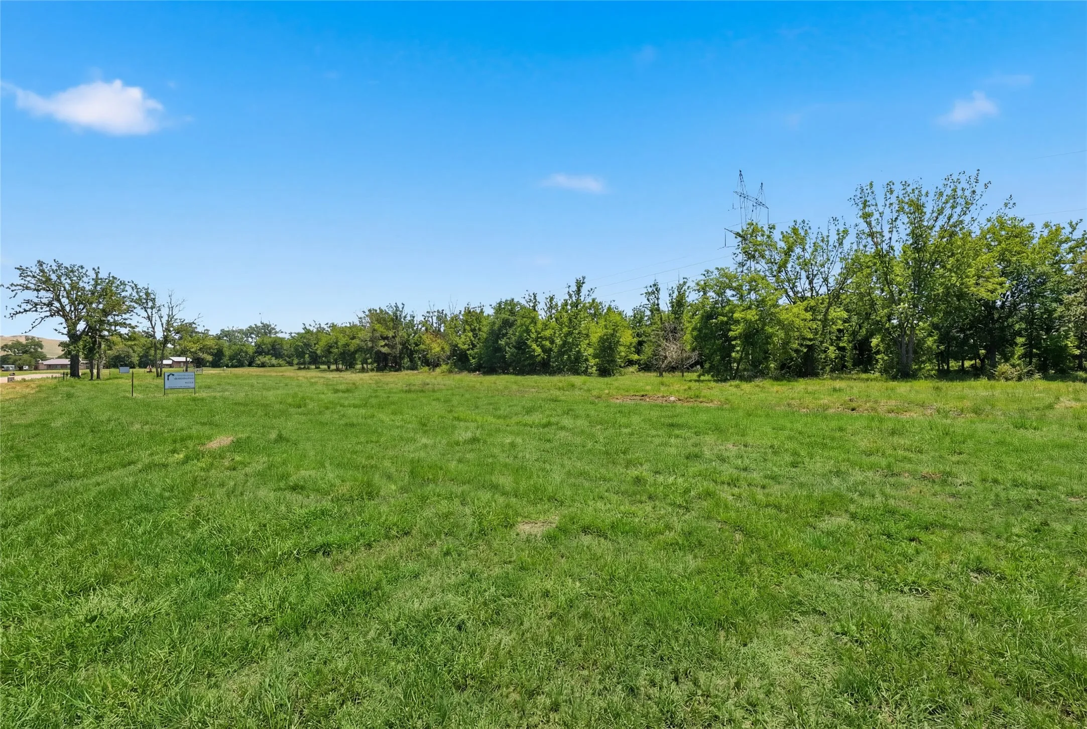 This is a photograph of Lot 4 Block G and was captured in February. It has been digitally enhanced to emphasize the presence of leaves and grass.