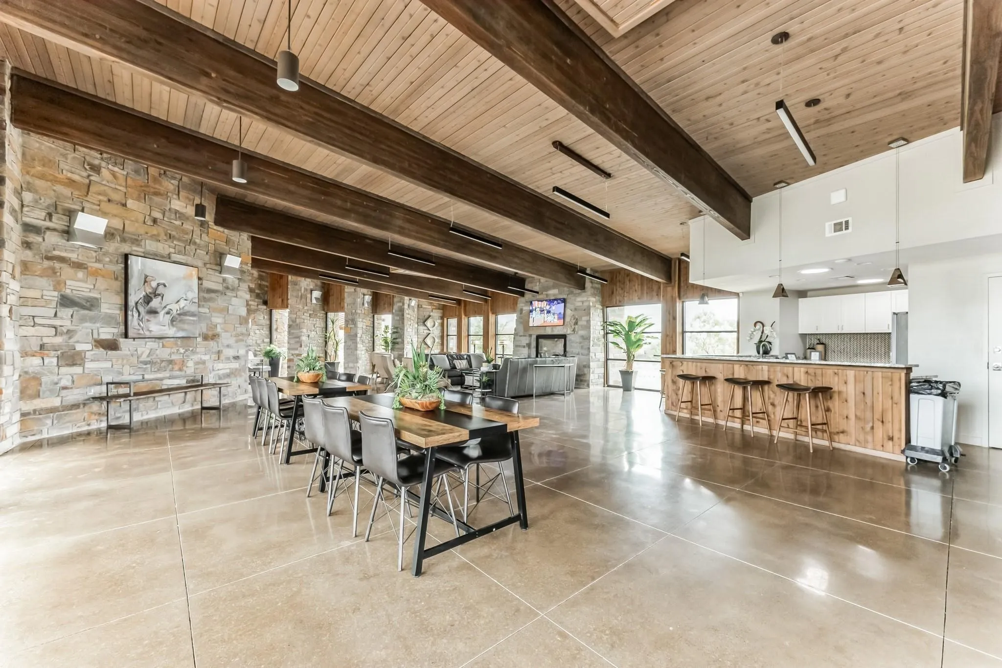 Dining area featuring a high wood beamed ceiling