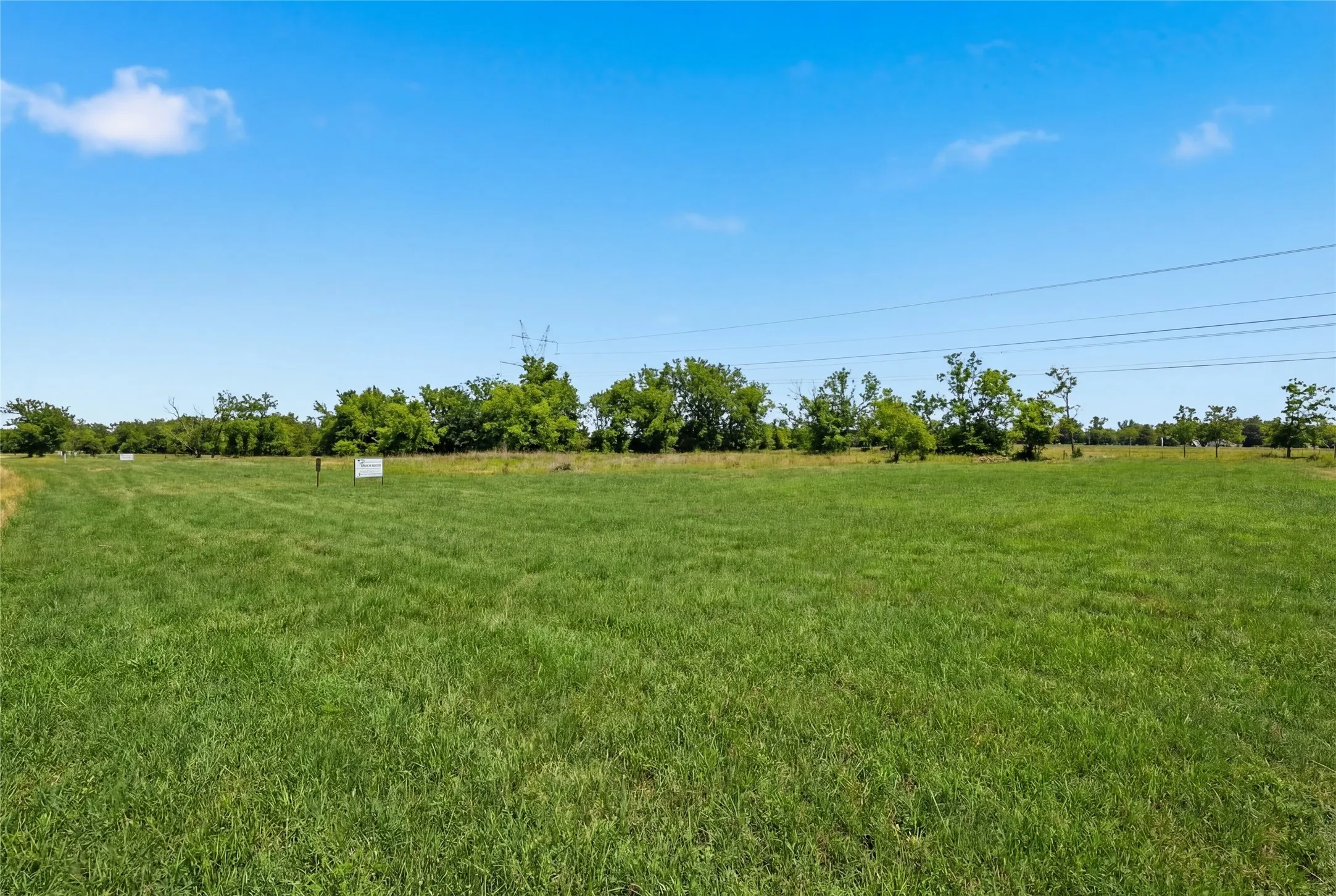 This is a photograph of Lot 2 Block G and was captured in February. It has been digitally enhanced to emphasize the presence of leaves and grass.