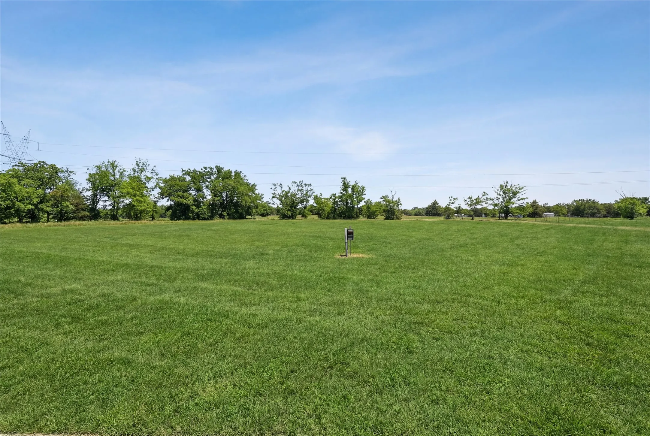 This is a photograph of Lot 2 Block G and was captured in February. It has been digitally enhanced to emphasize the presence of leaves and grass.