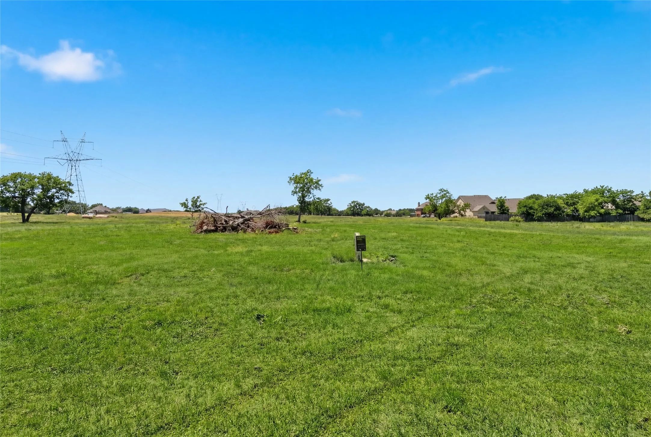 This is a photograph of Lot 2 Block H and was captured in February. It has been digitally enhanced to emphasize the presence of leaves and grass.