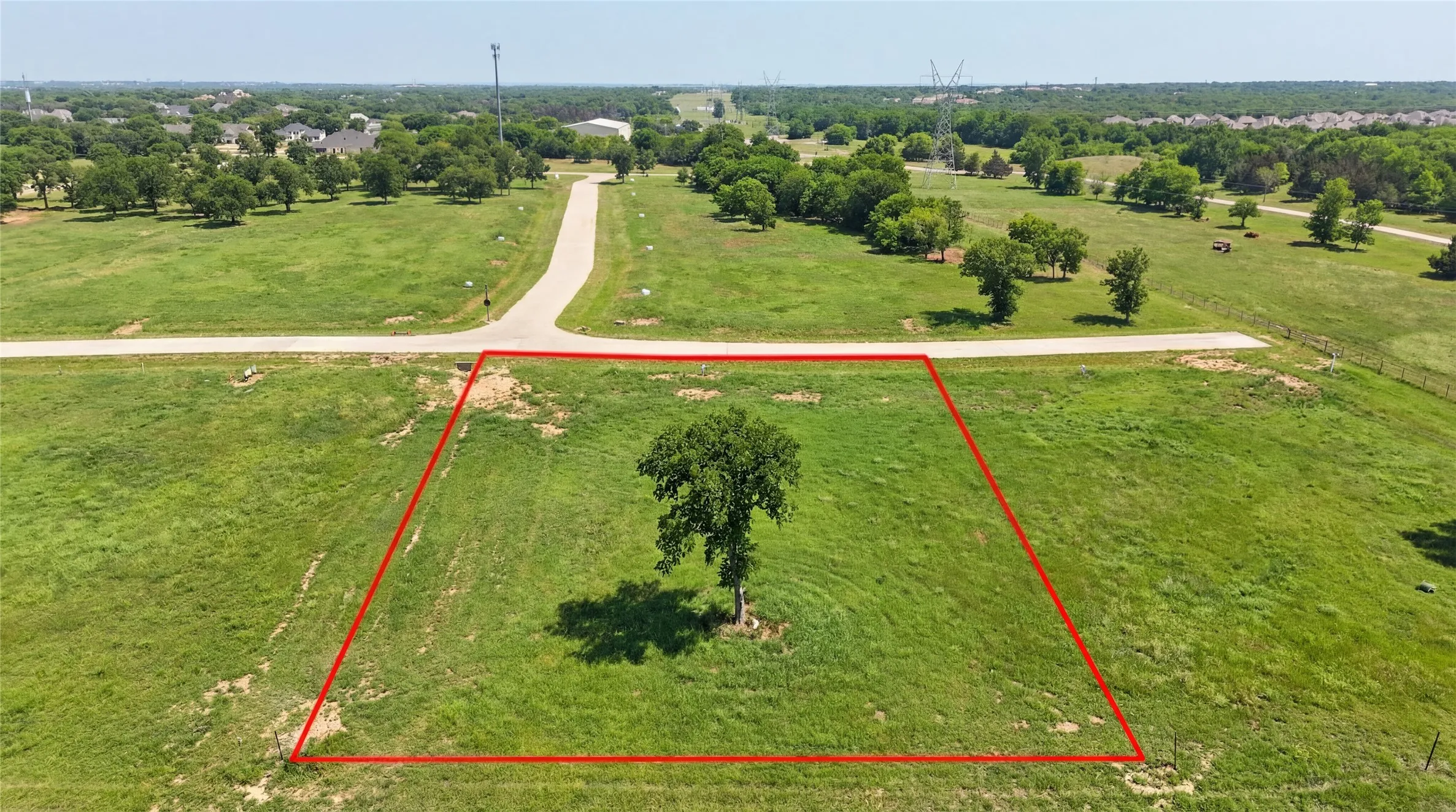 This is an aerial photograph of Lot 2 Block H and was captured in February. It has been digitally enhanced to emphasize the presence of leaves and grass.