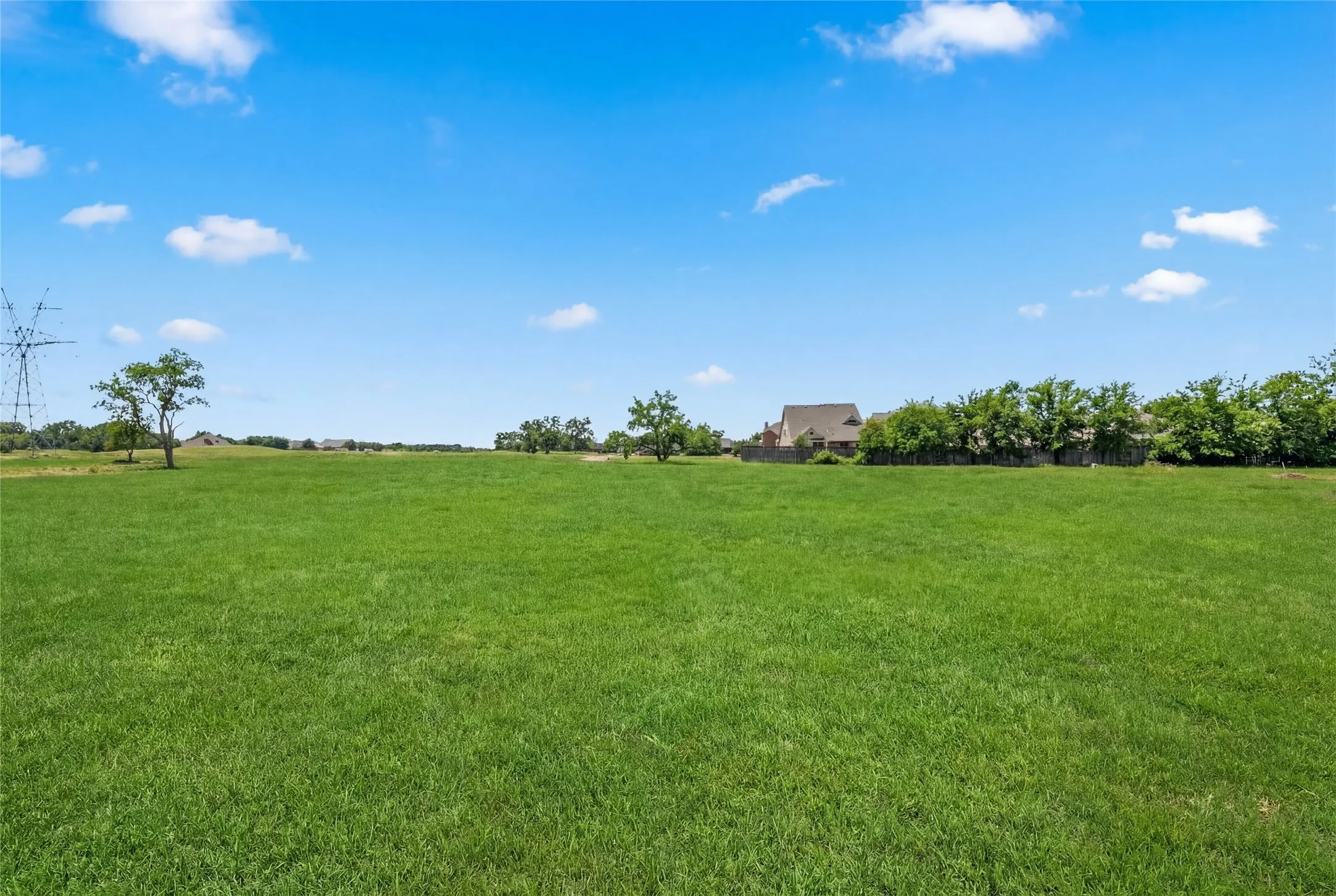 This is a photograph of Lot 3 Block H and was captured in February. It has been digitally enhanced to emphasize the presence of leaves and grass.