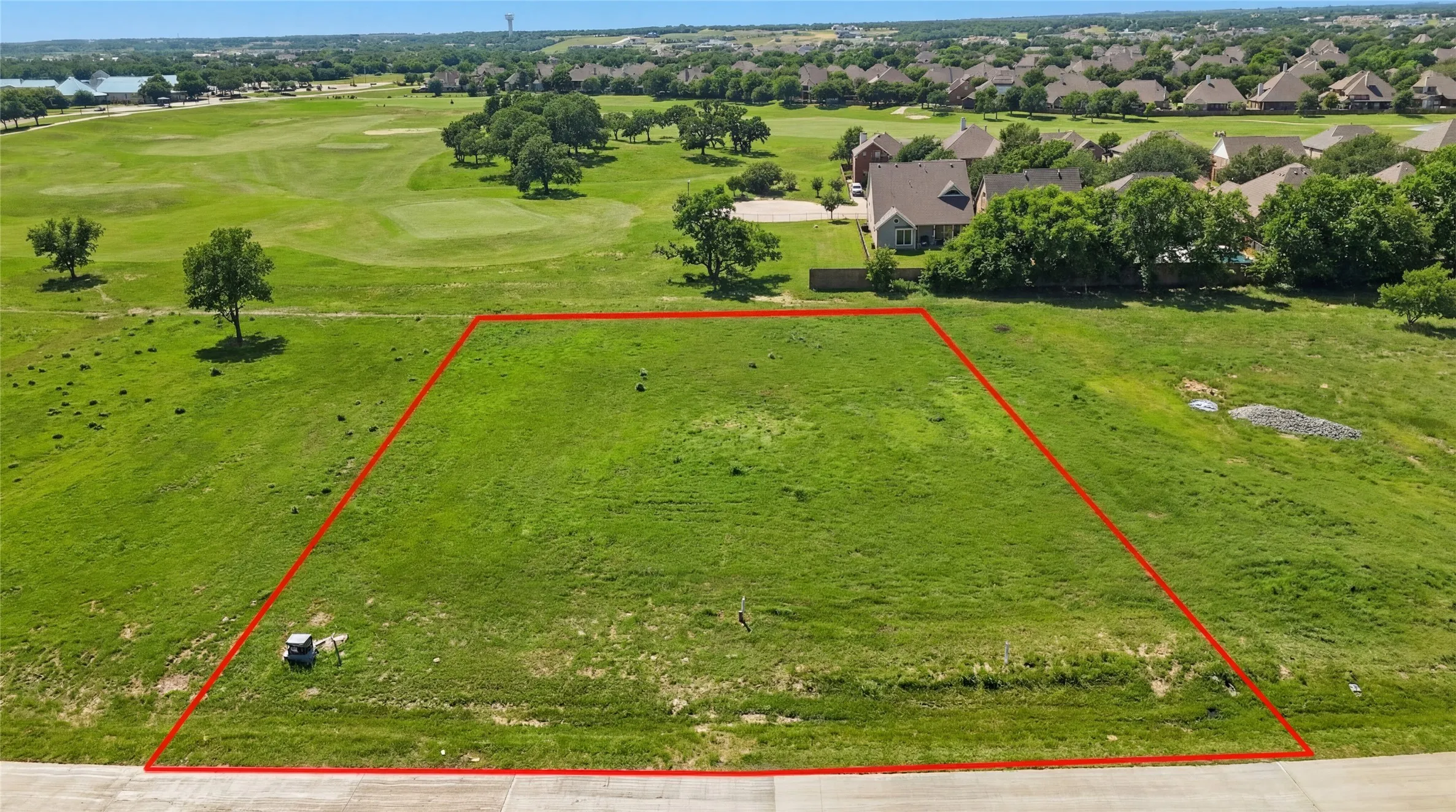 This is an aerial photograph of Lot 3 Block H and was captured in February. It has been digitally enhanced to emphasize the presence of leaves and grass.