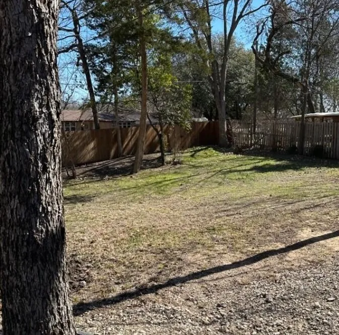 View of fenced backyard