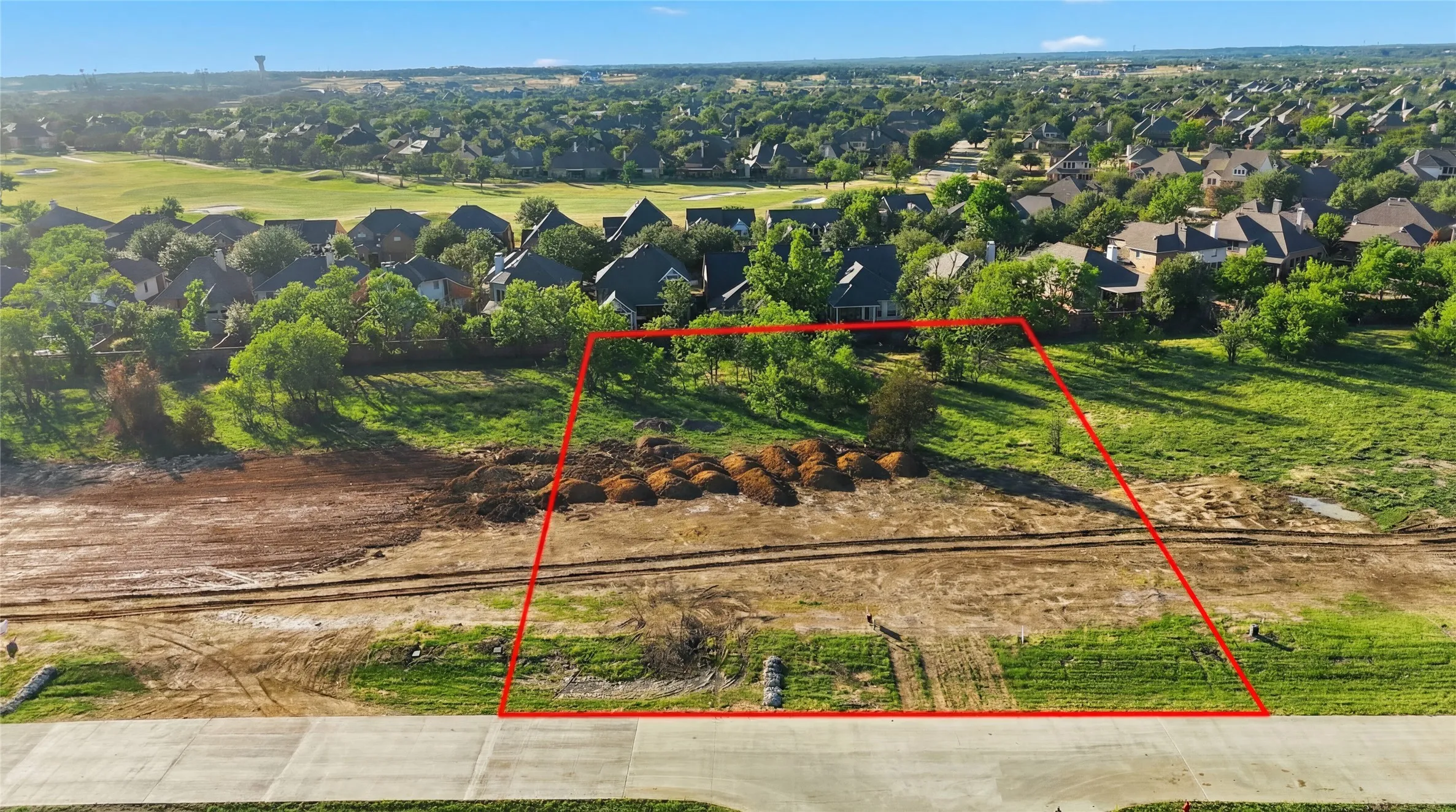 This is an aerial photograph of Lot 6 Block H and was captured in February. It has been digitally enhanced to emphasize the presence of leaves and grass.