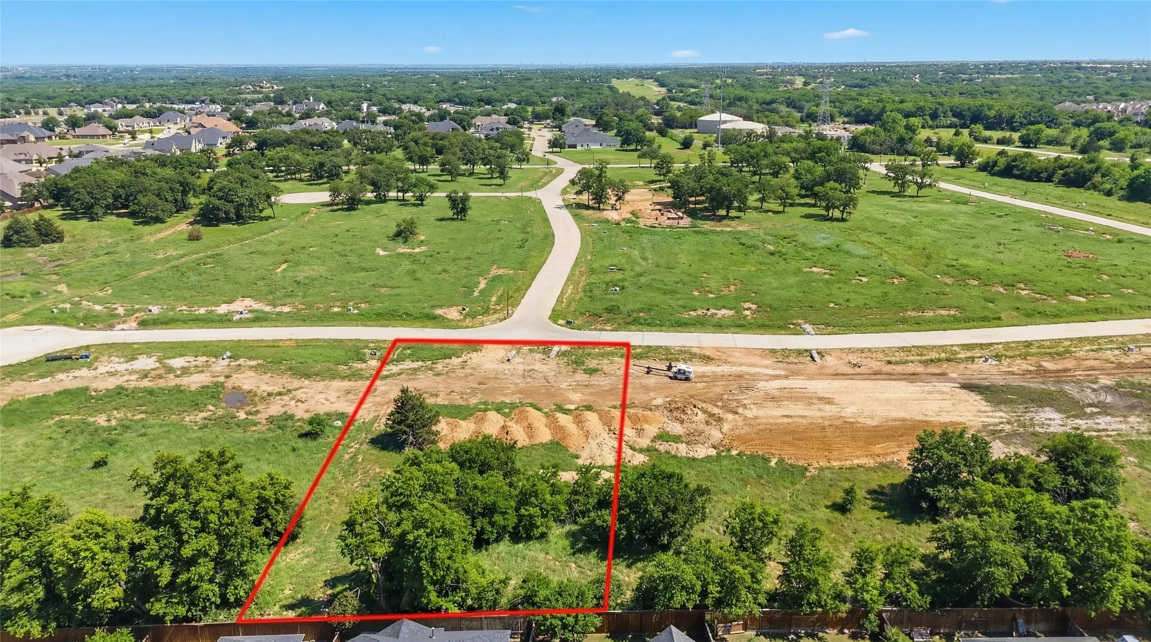 This is an aerial photograph of Lot 6 Block H and was captured in February. It has been digitally enhanced to emphasize the presence of leaves and grass.