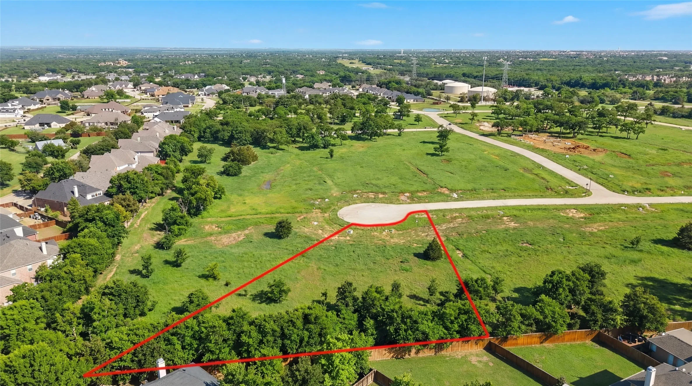 This is an aerial photograph of Lot 8 Block H and was captured in February. It has been digitally enhanced to emphasize the presence of leaves and grass.