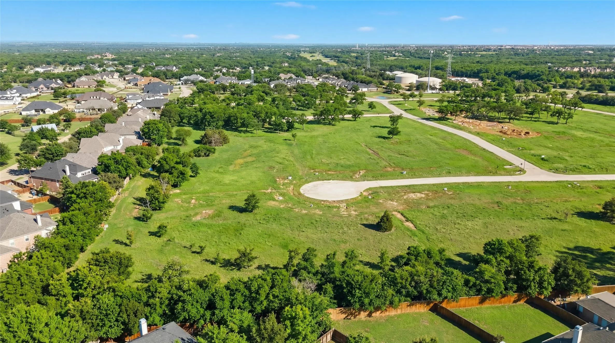 This is an aerial photograph of Lot 8 Block H and was captured in February. It has been digitally enhanced to emphasize the presence of leaves and grass.