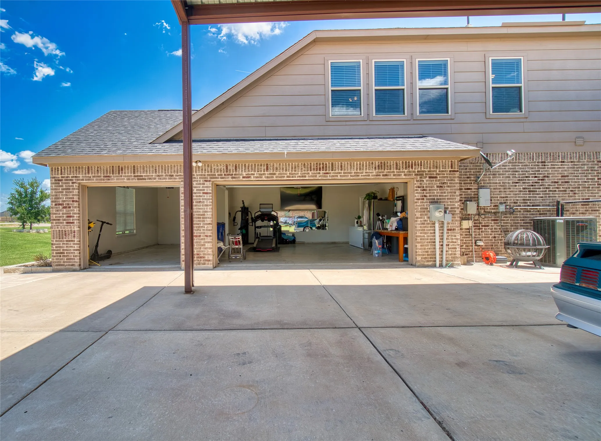 3 car garage with additional room for golf cart
