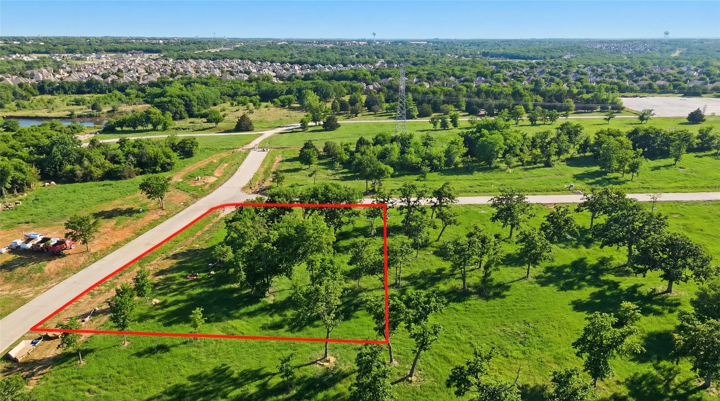This is an aerial photograph of Lot 6 Block J and was captured in February. It has been digitally enhanced to emphasize the presence of leaves and grass.